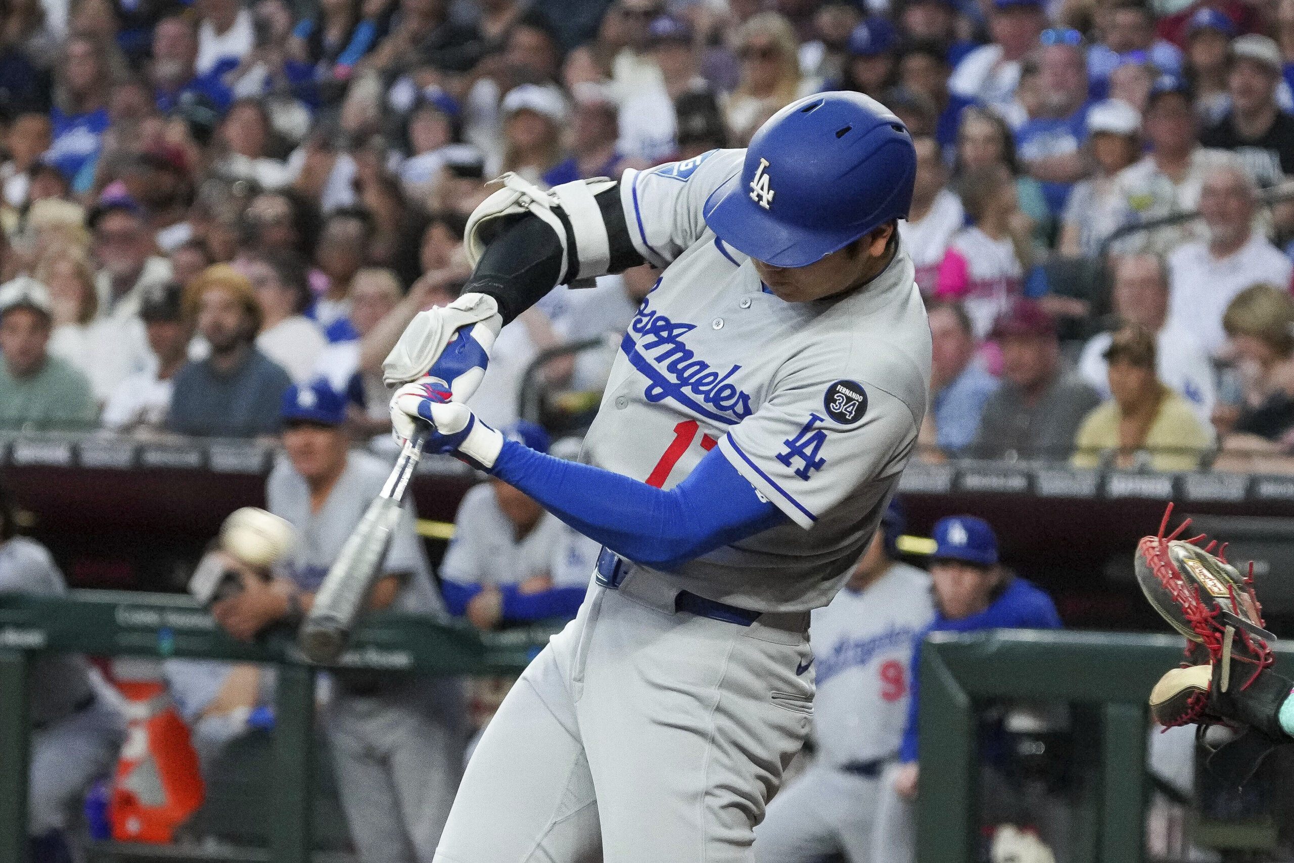 Dodgers star Shohei Ohtani hits a double against the Arizona...