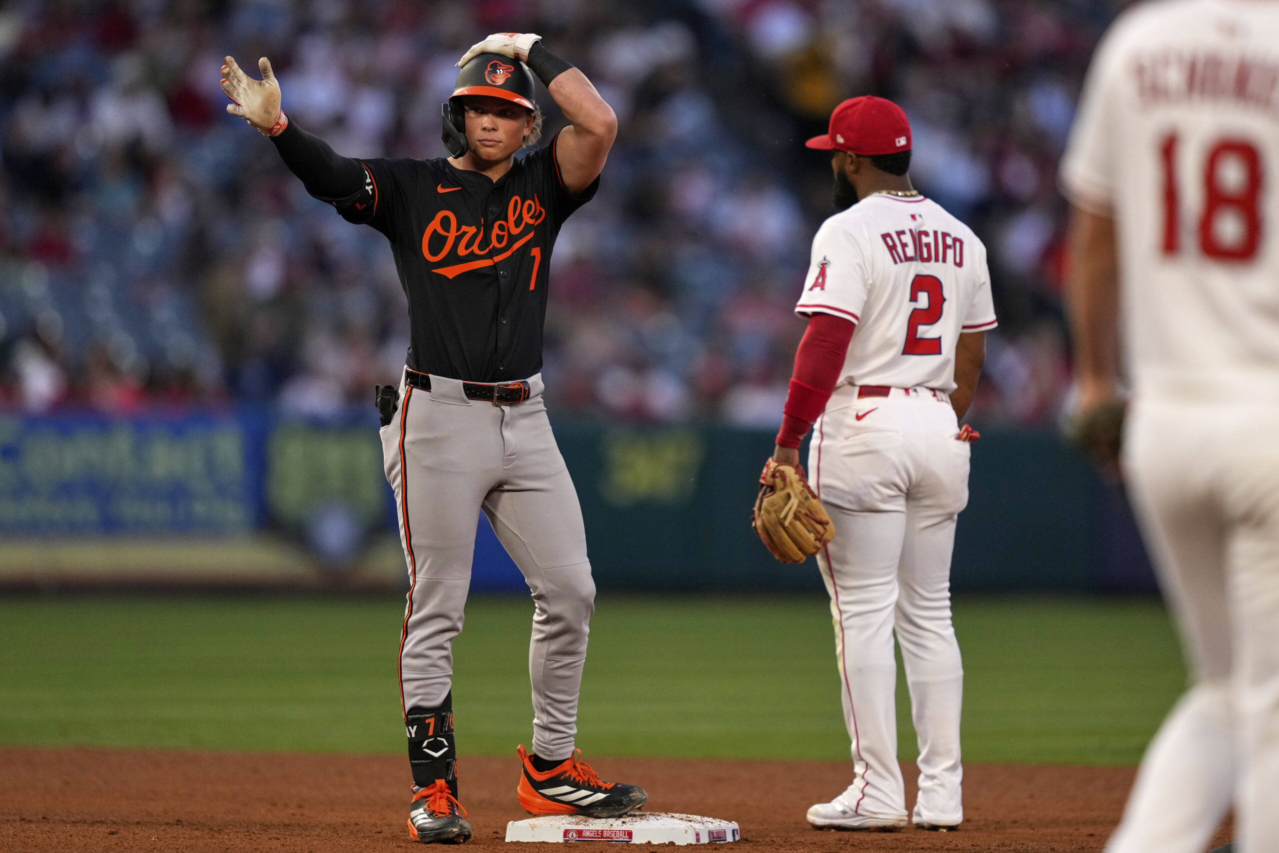The Baltimore Orioles’ Jackson Holliday, left, celebrates after hitting a...