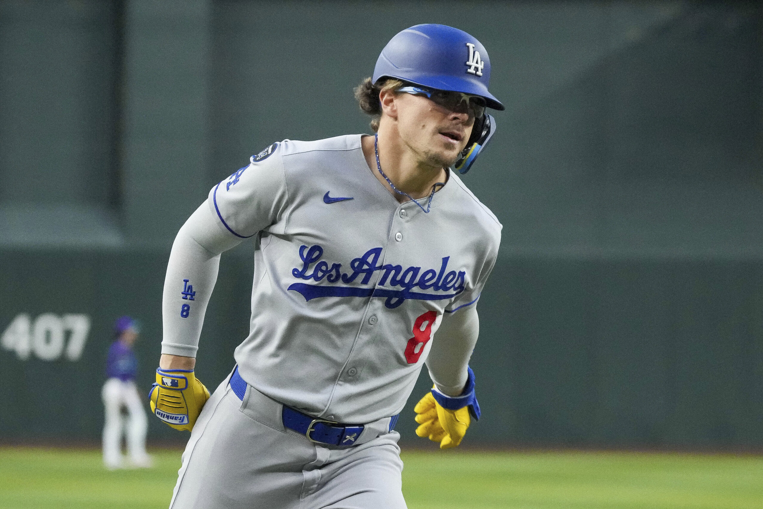 The Dodgers’ Kike Hernández rounds third base after hitting a...