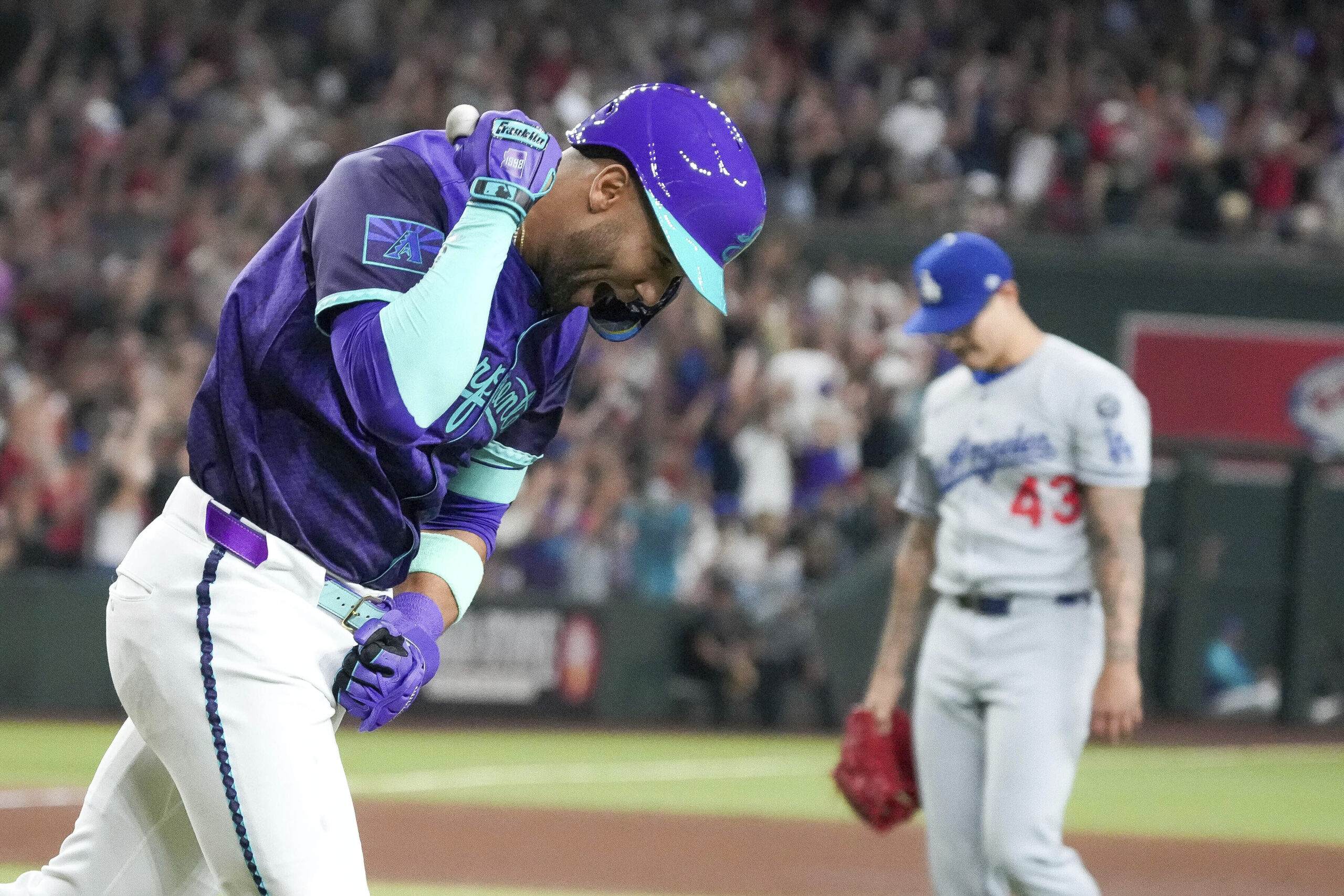 The Arizona Diamondbacks’ Lourdes Gurriel Jr., left, pumps his fist...