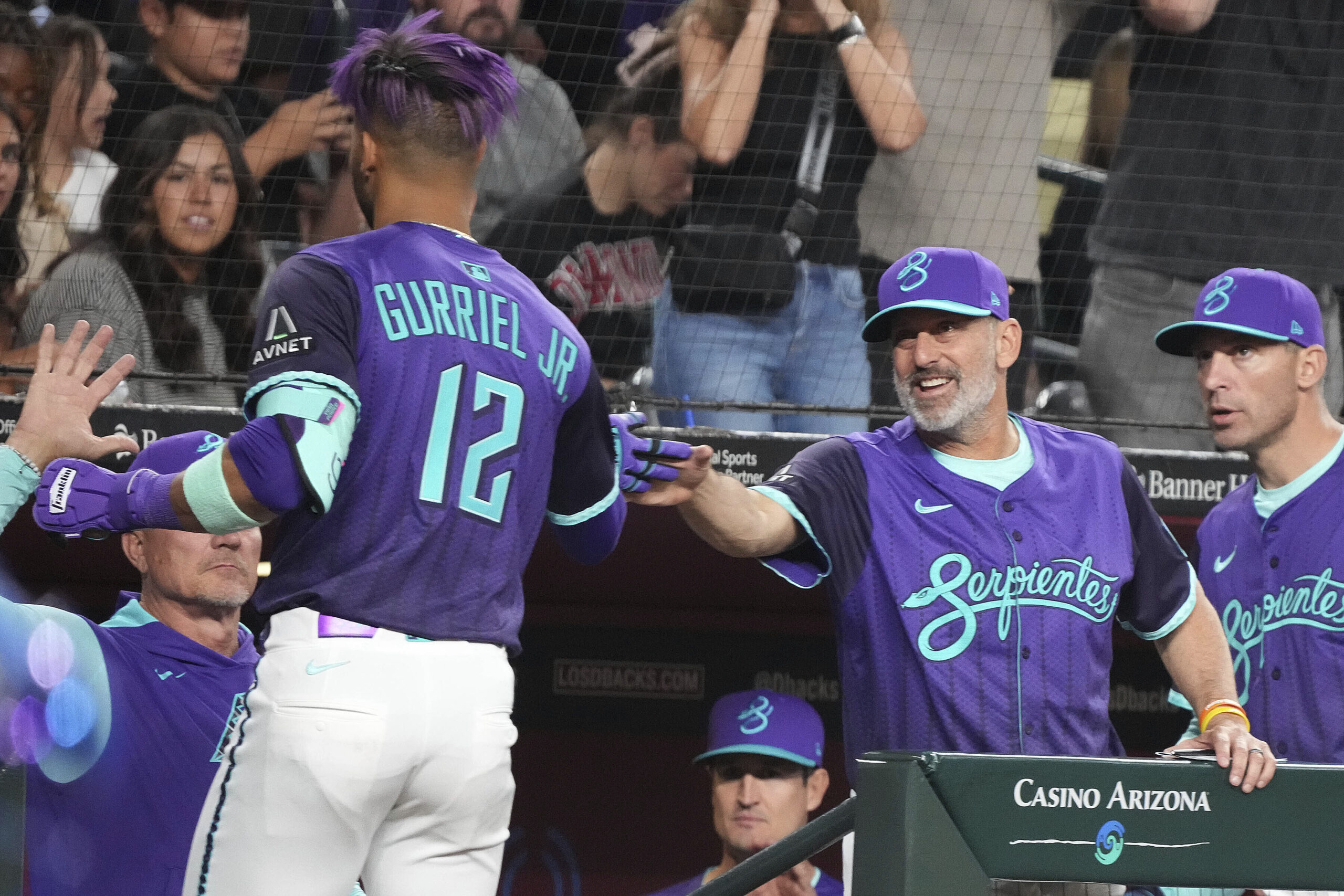 The Arizona Diamondbacks’ Lourdes Gurriel Jr. (12) slaps hands with...