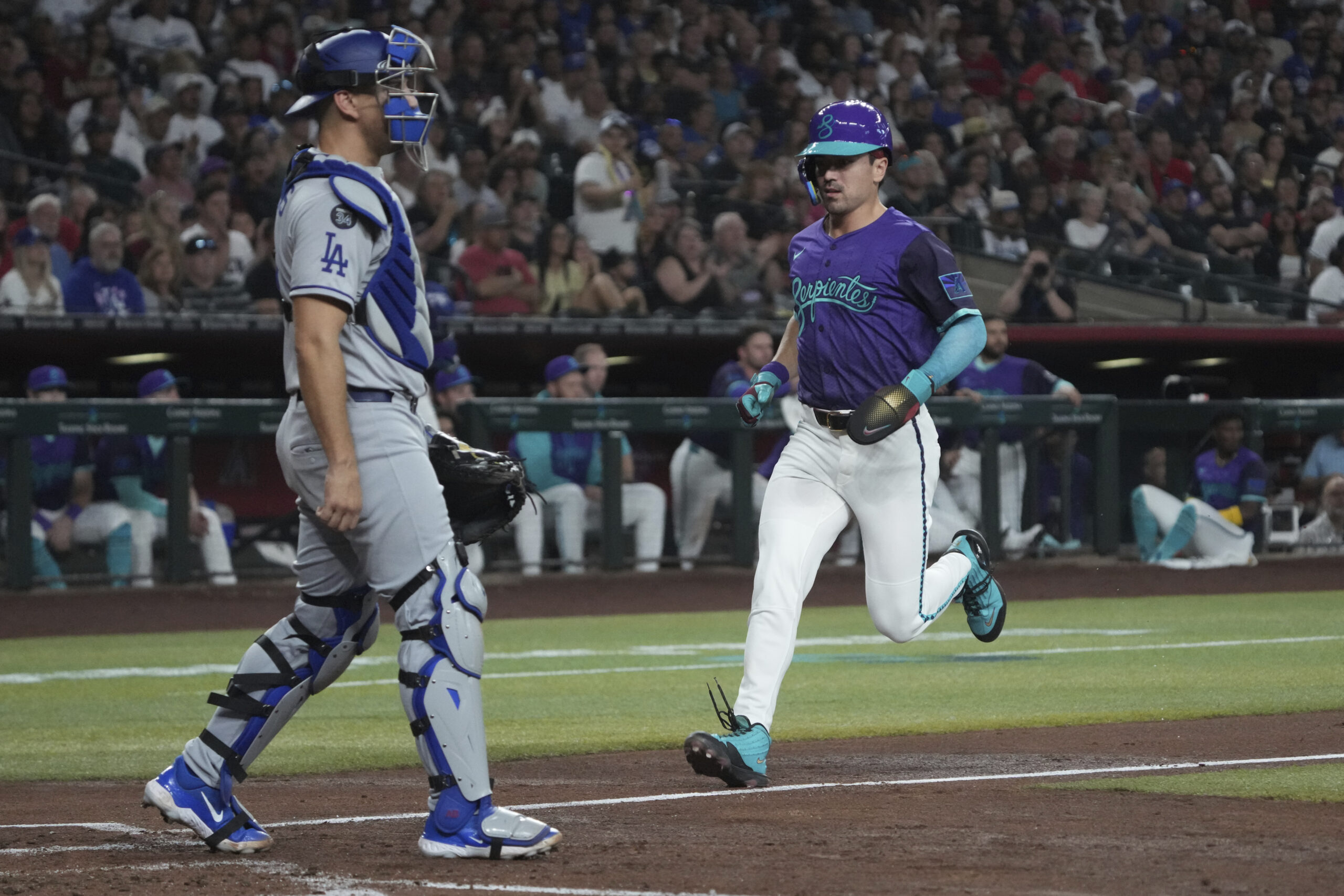 Arizona Diamondbacks outfielder Corbin Carroll (7) scores a run against...