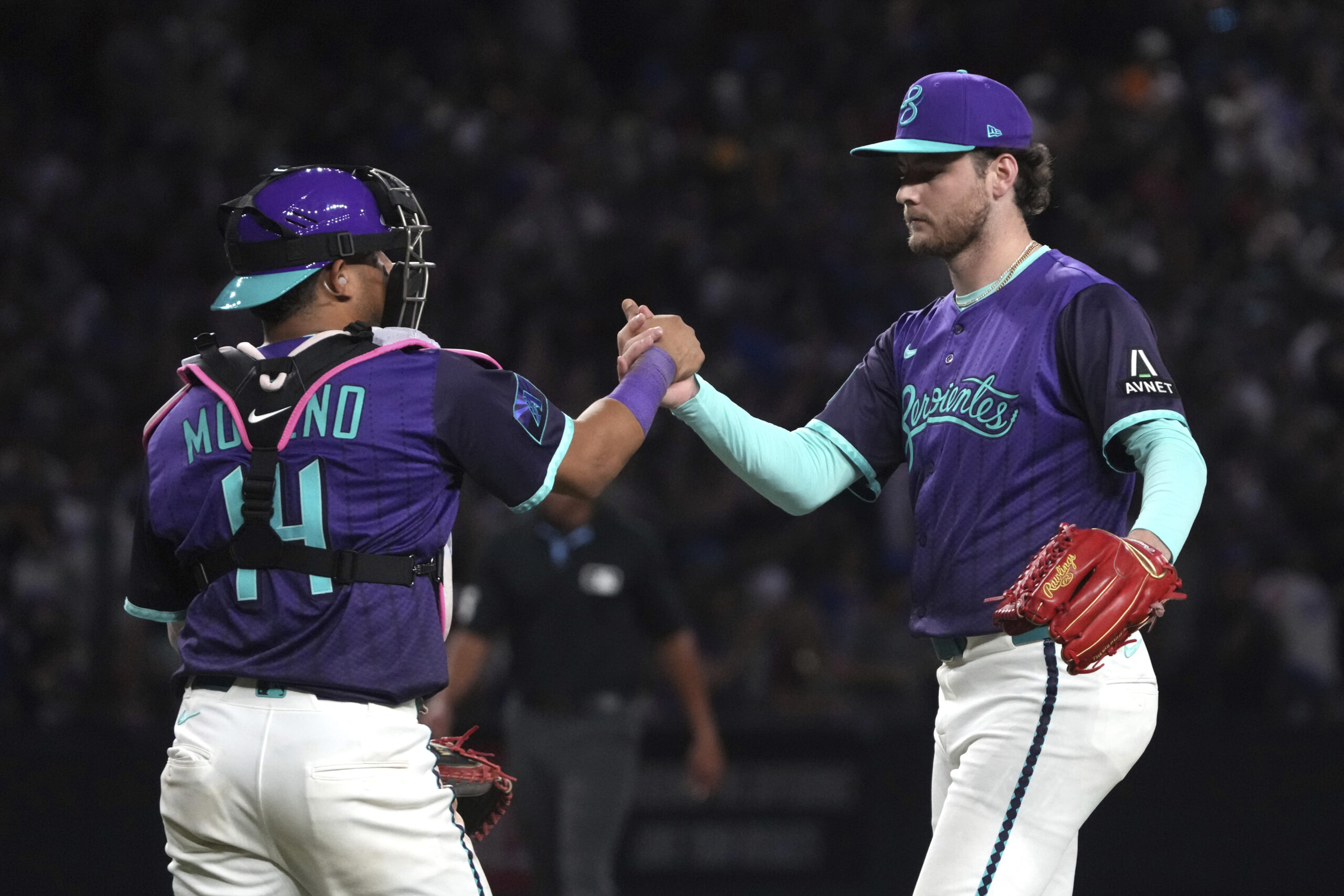 Arizona Diamondbacks catcher Gabriel Moreno (14) and pitcher Ryne Nelson,...