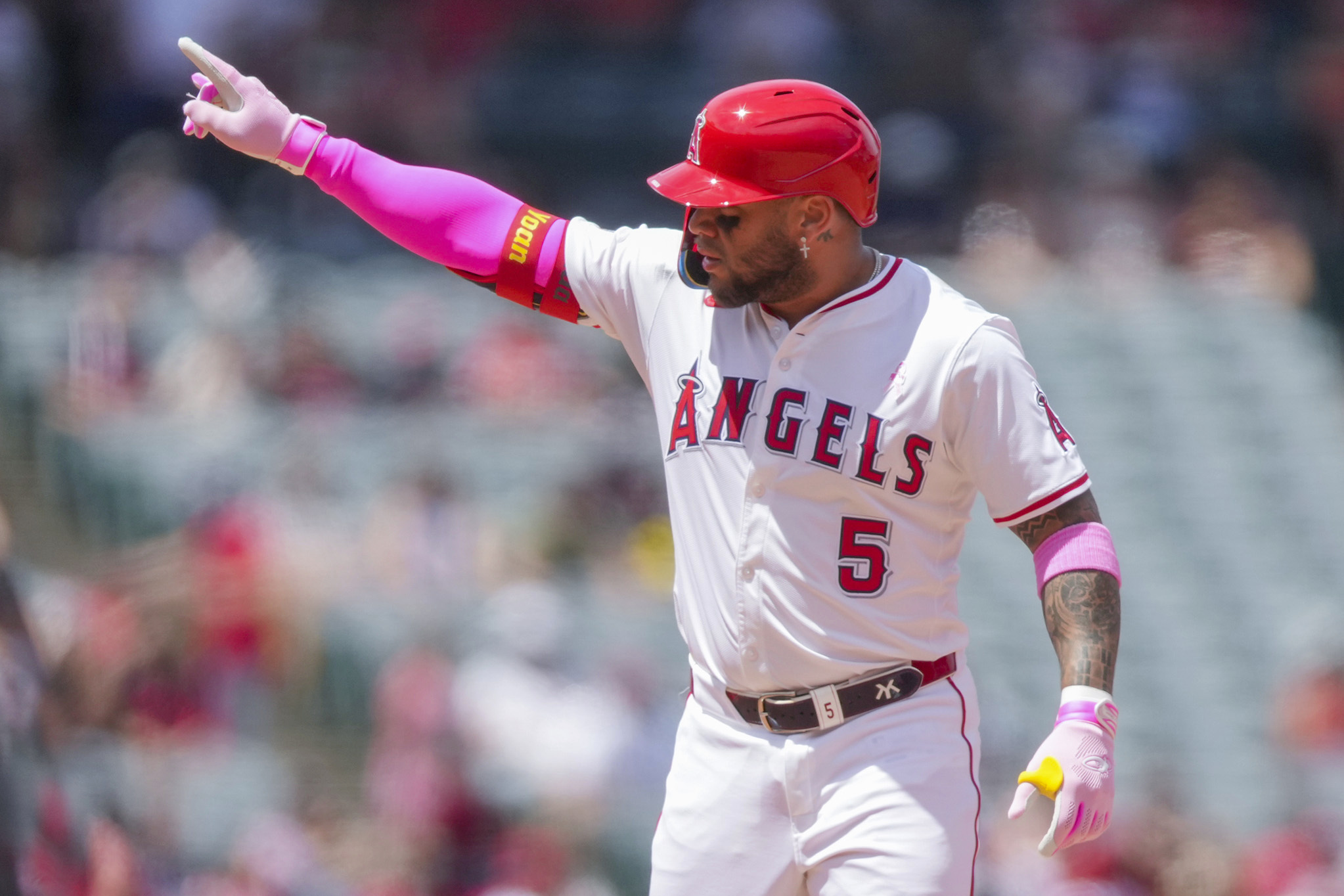 Angels’ Yoan Moncada gestures from second base during the third...