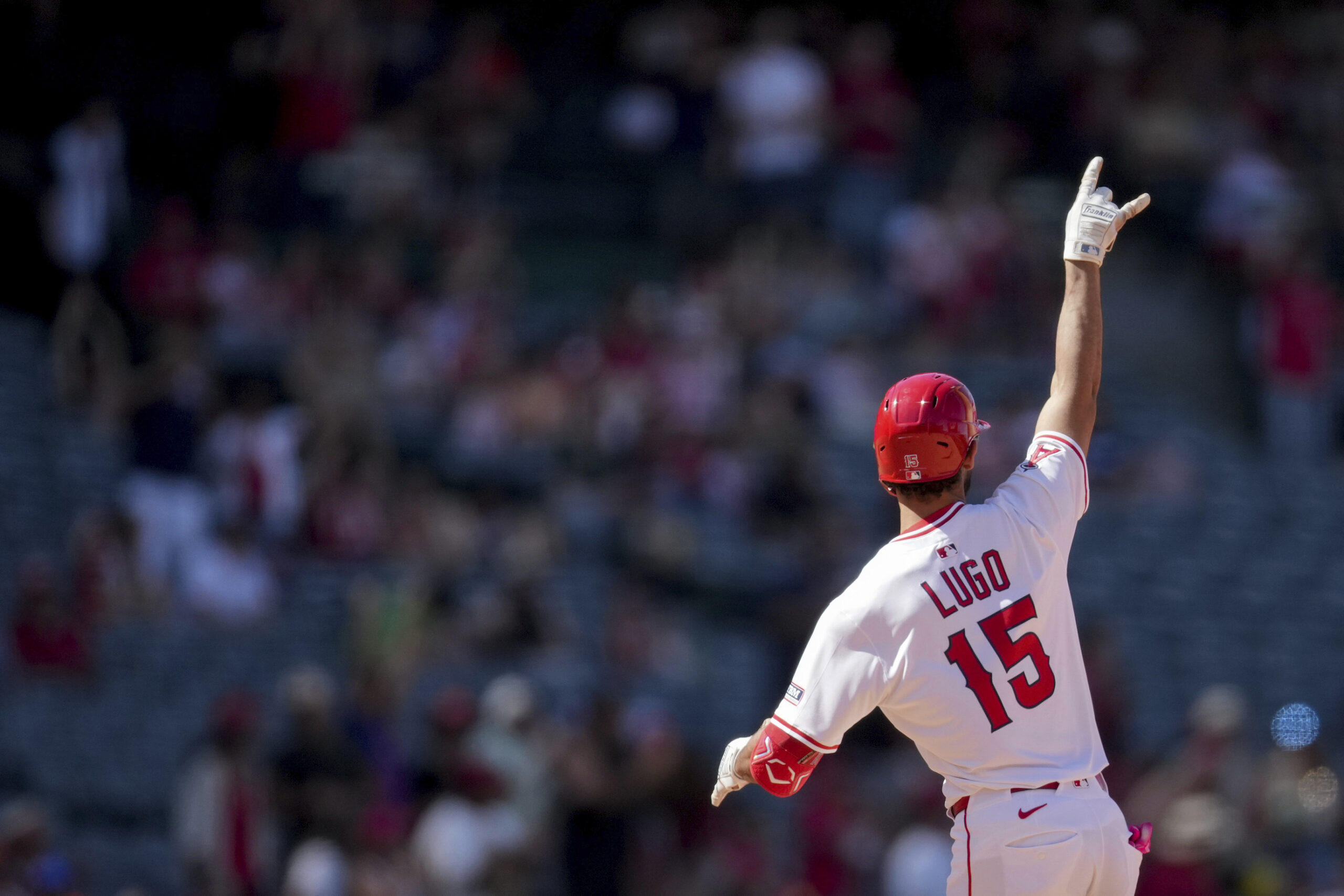 Angels’ Matthew Lugo reacts after hitting a home run during...