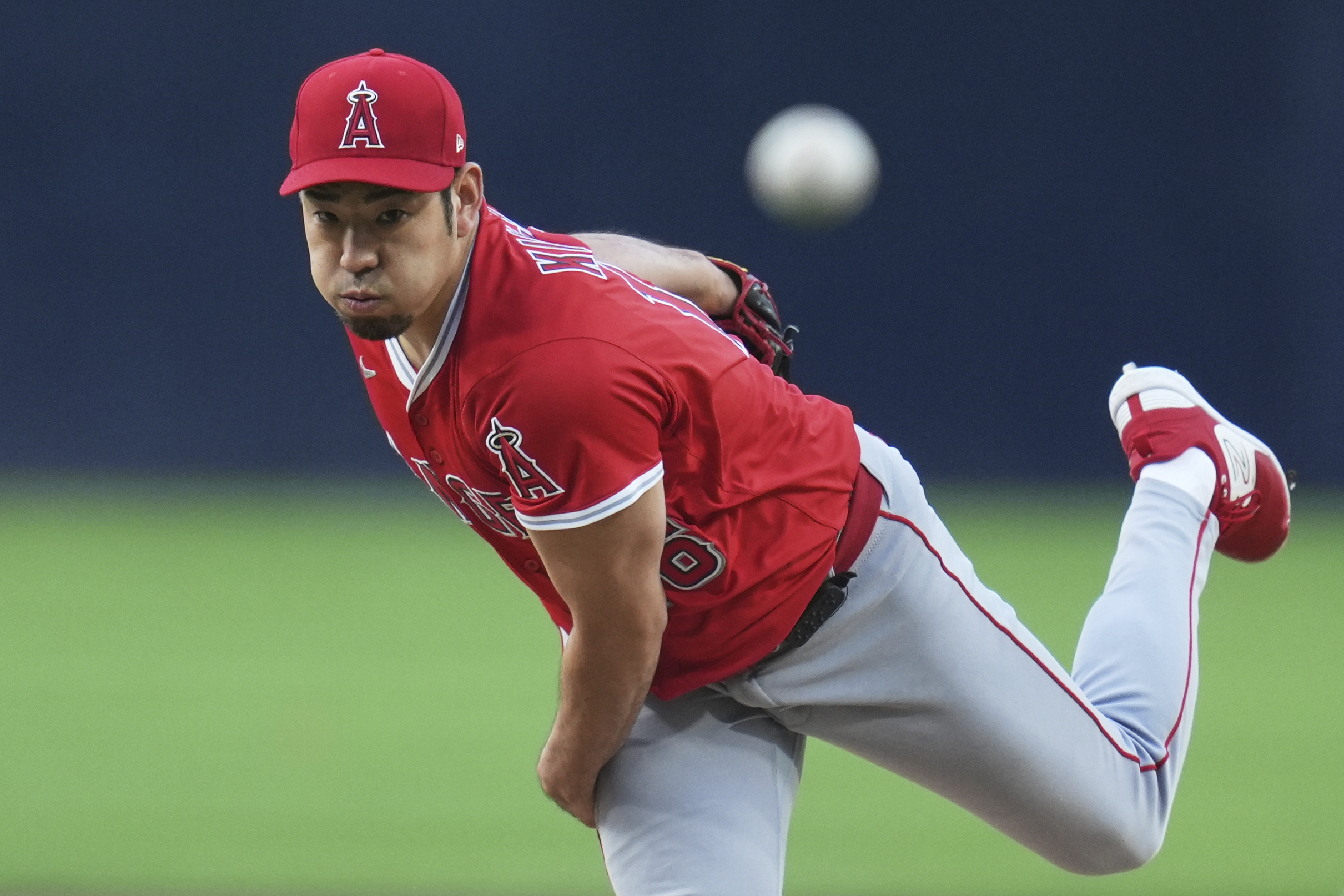 Angels starting pitcher Yusei Kikuchi throws to the plate during...