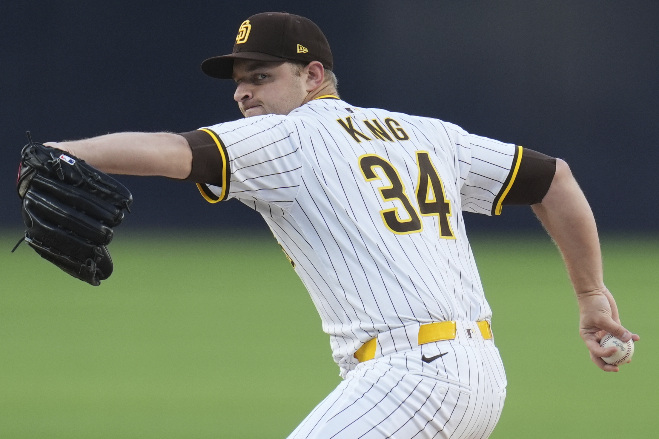 San Diego Padres starting pitcher Michael King throws to the...