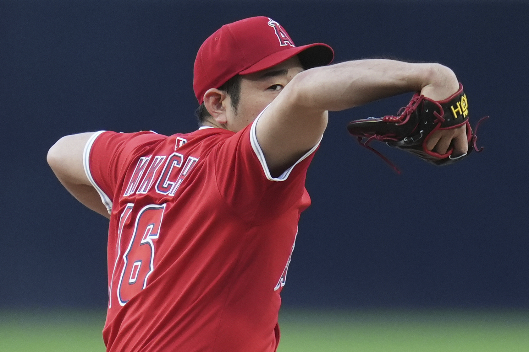 Angels starting pitcher Yusei Kikuchi throws to the plate during...