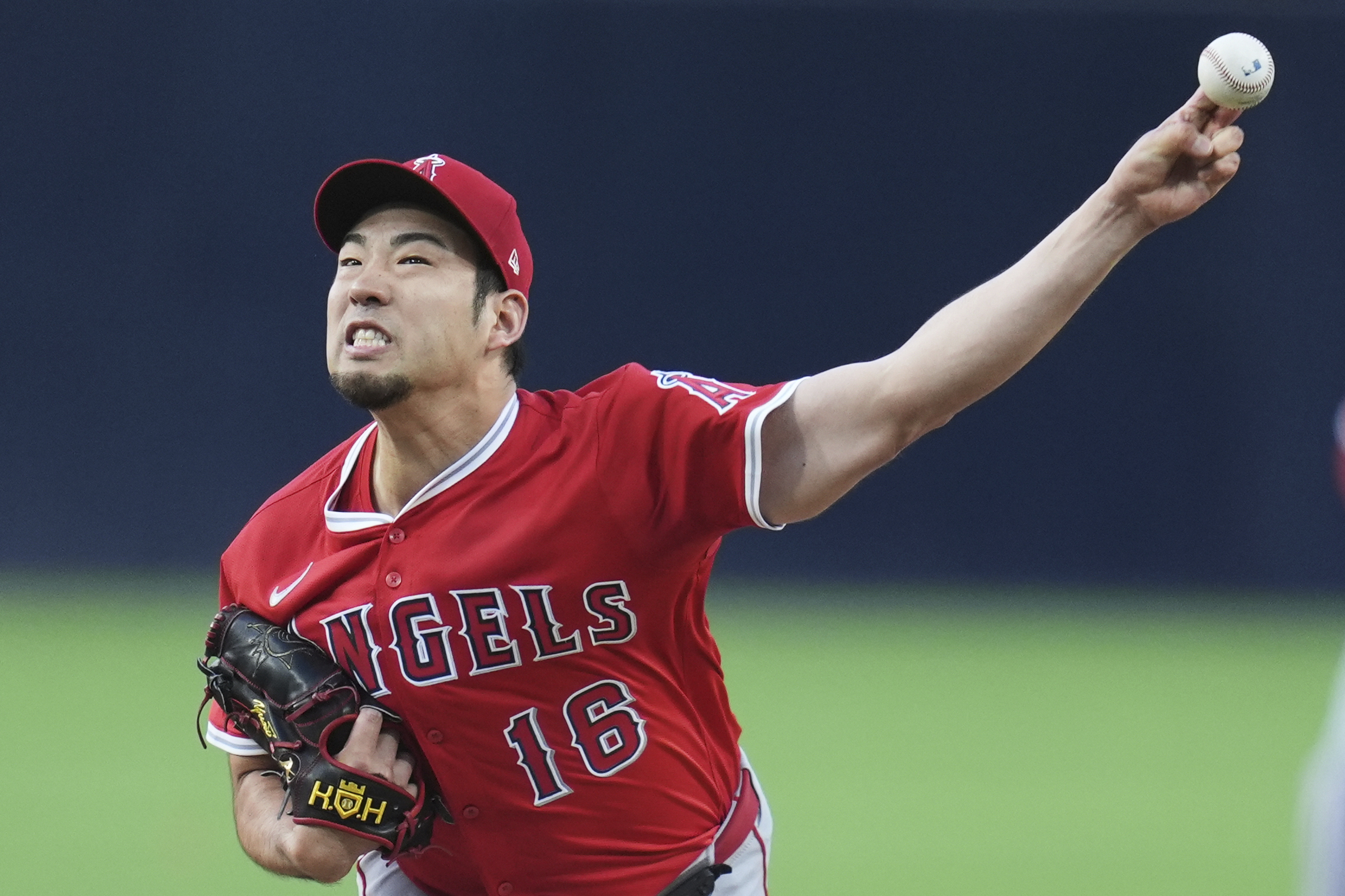 Angels starting pitcher Yusei Kikuchi throws to the plate during...