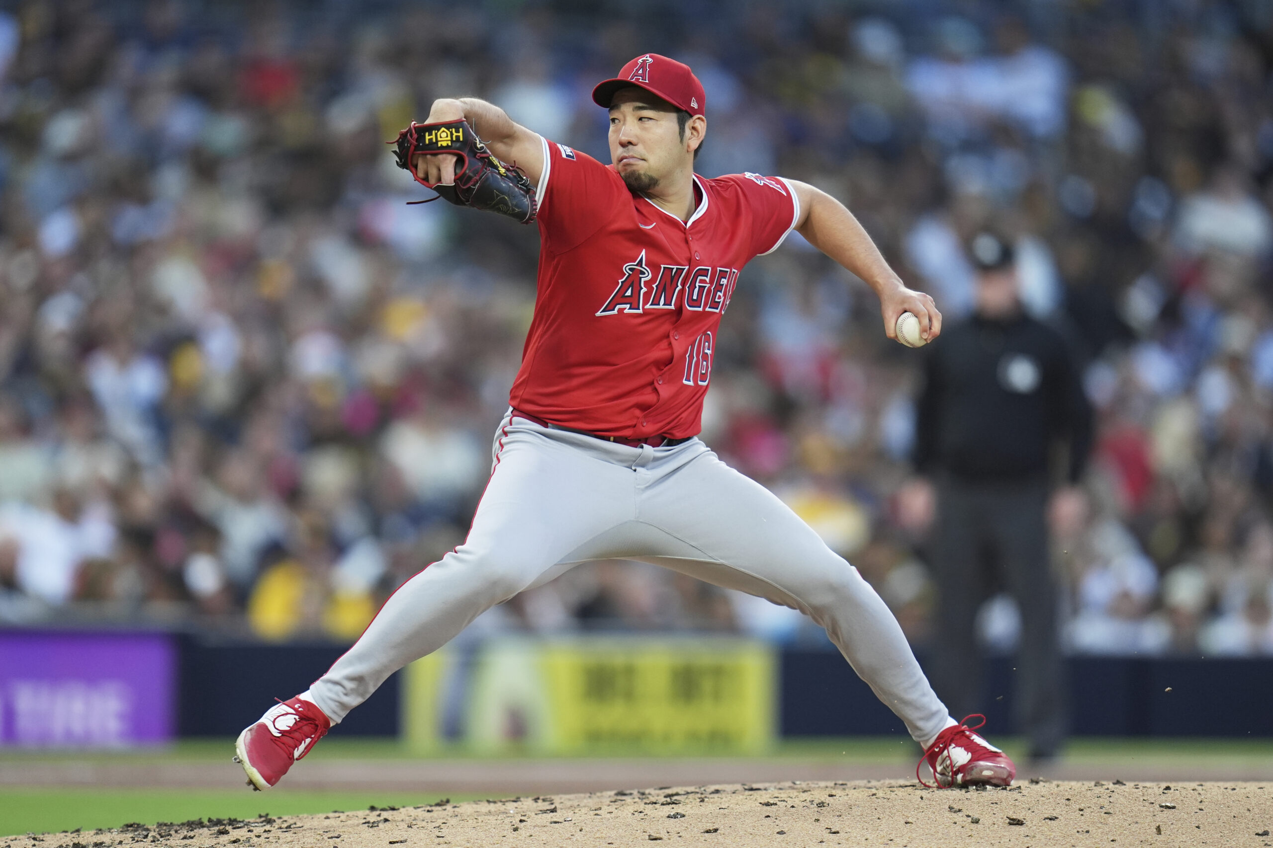 Angels starting pitcher Yusei Kikuchi throws to the plate during...