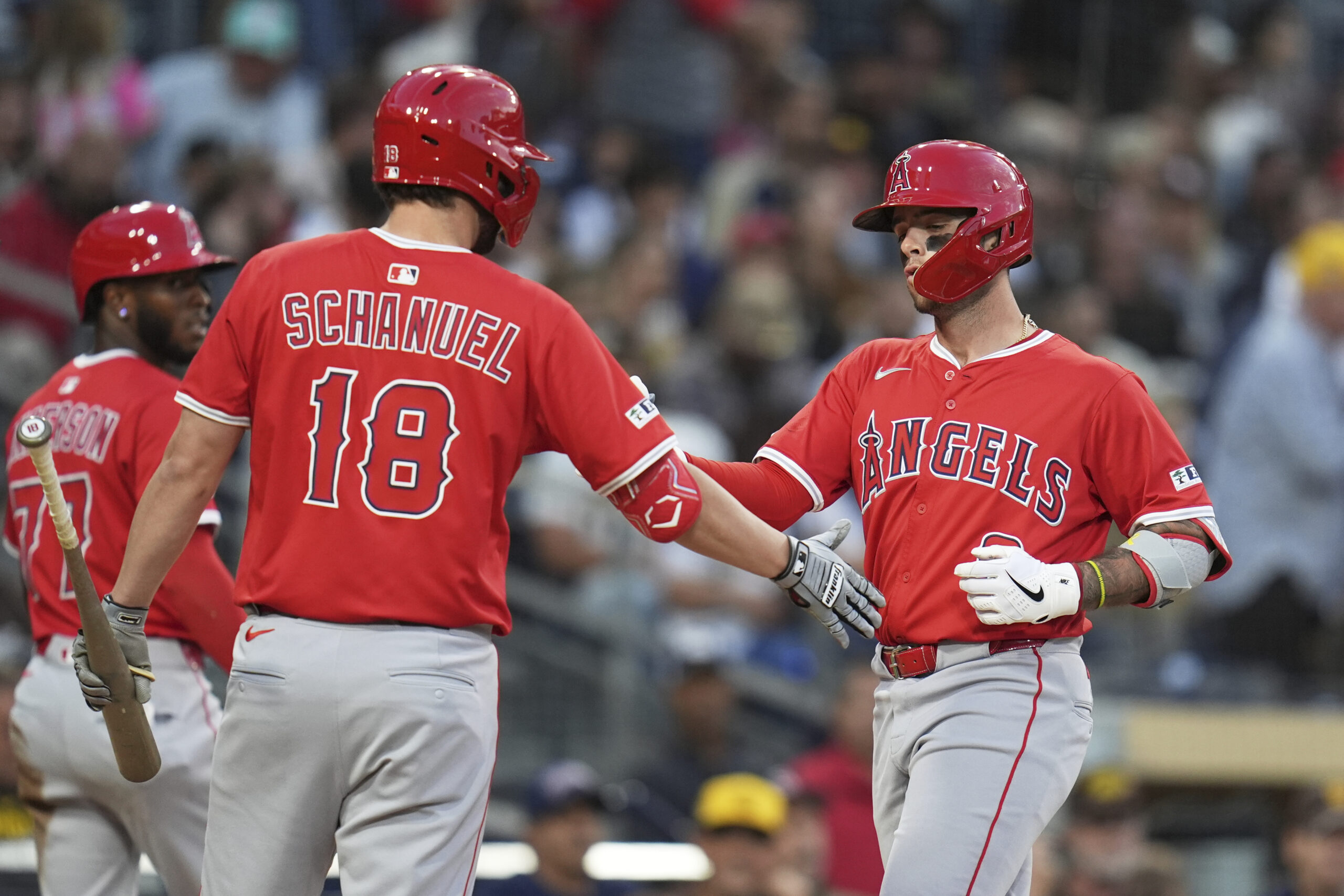The Angels’ Zach Neto, right, celebrates with teammate Nolan Schanuel...