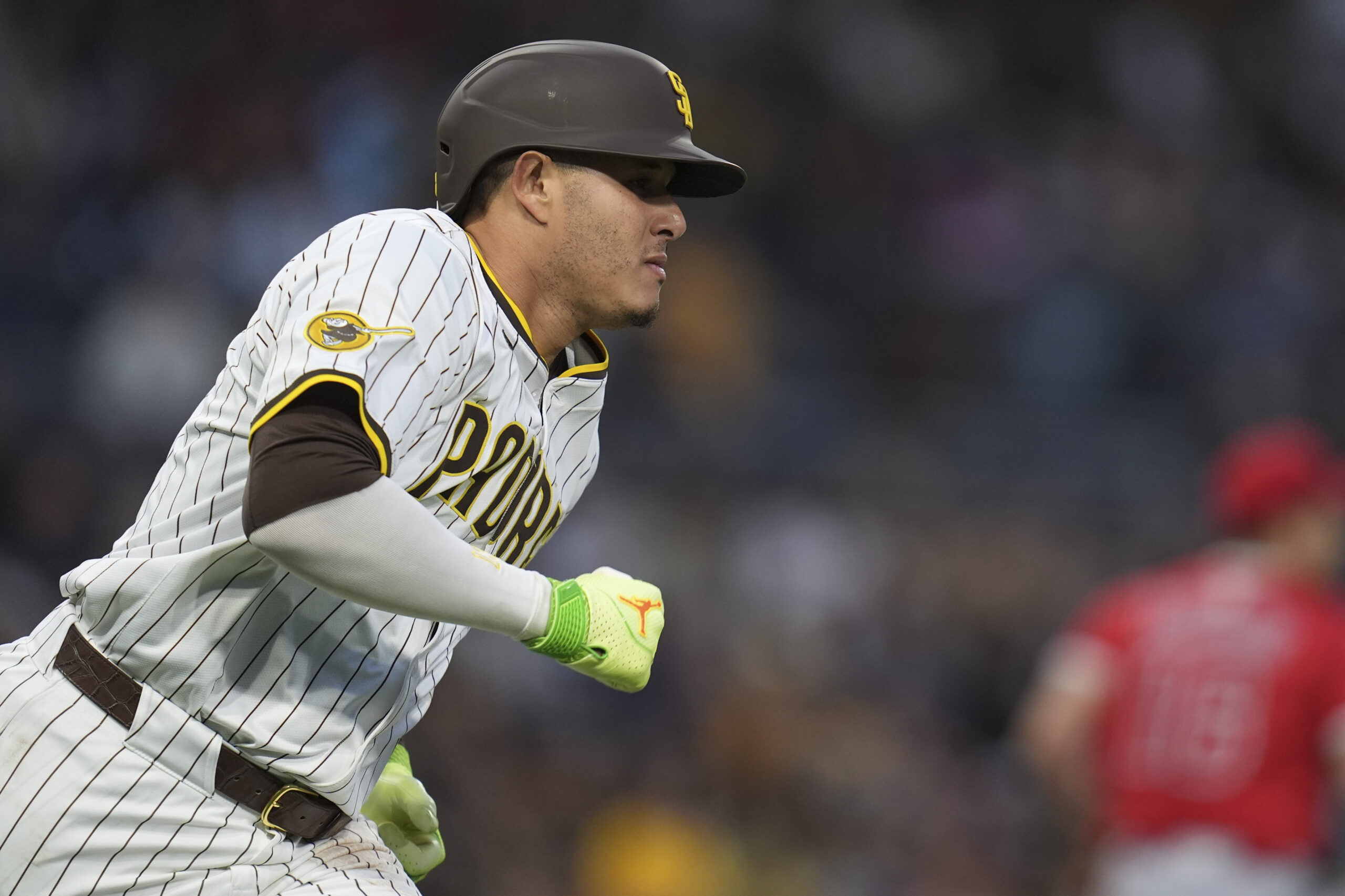 The San Diego Padres’ Manny Machado watches his single as...