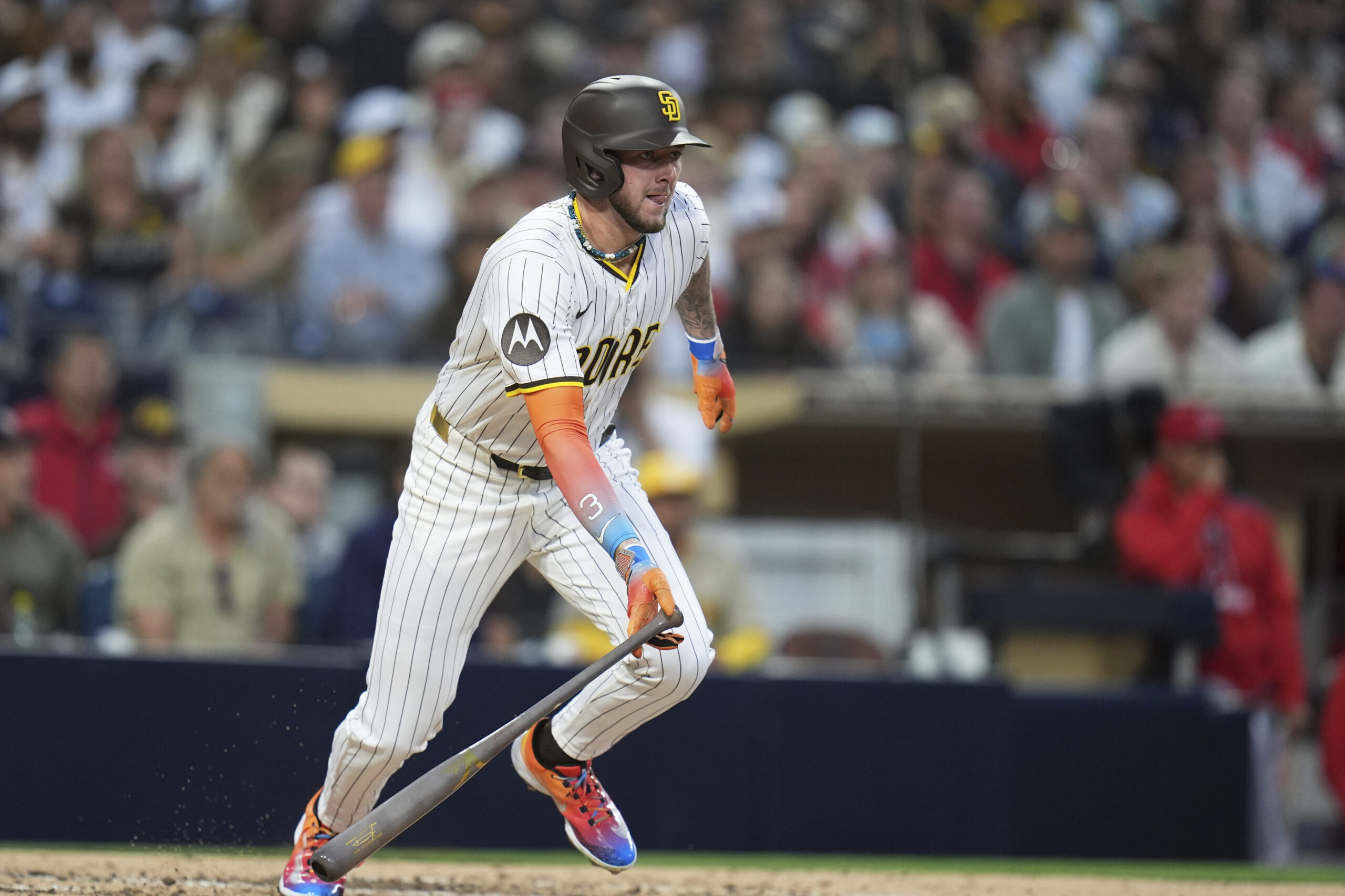The San Diego Padres’ Jackson Merrill watches his RBI single...