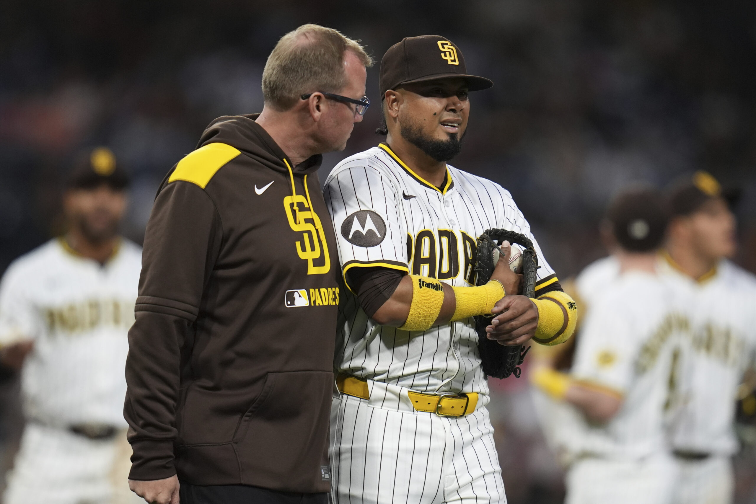 San Diego Padres first baseman Luis Arraez talks with a...