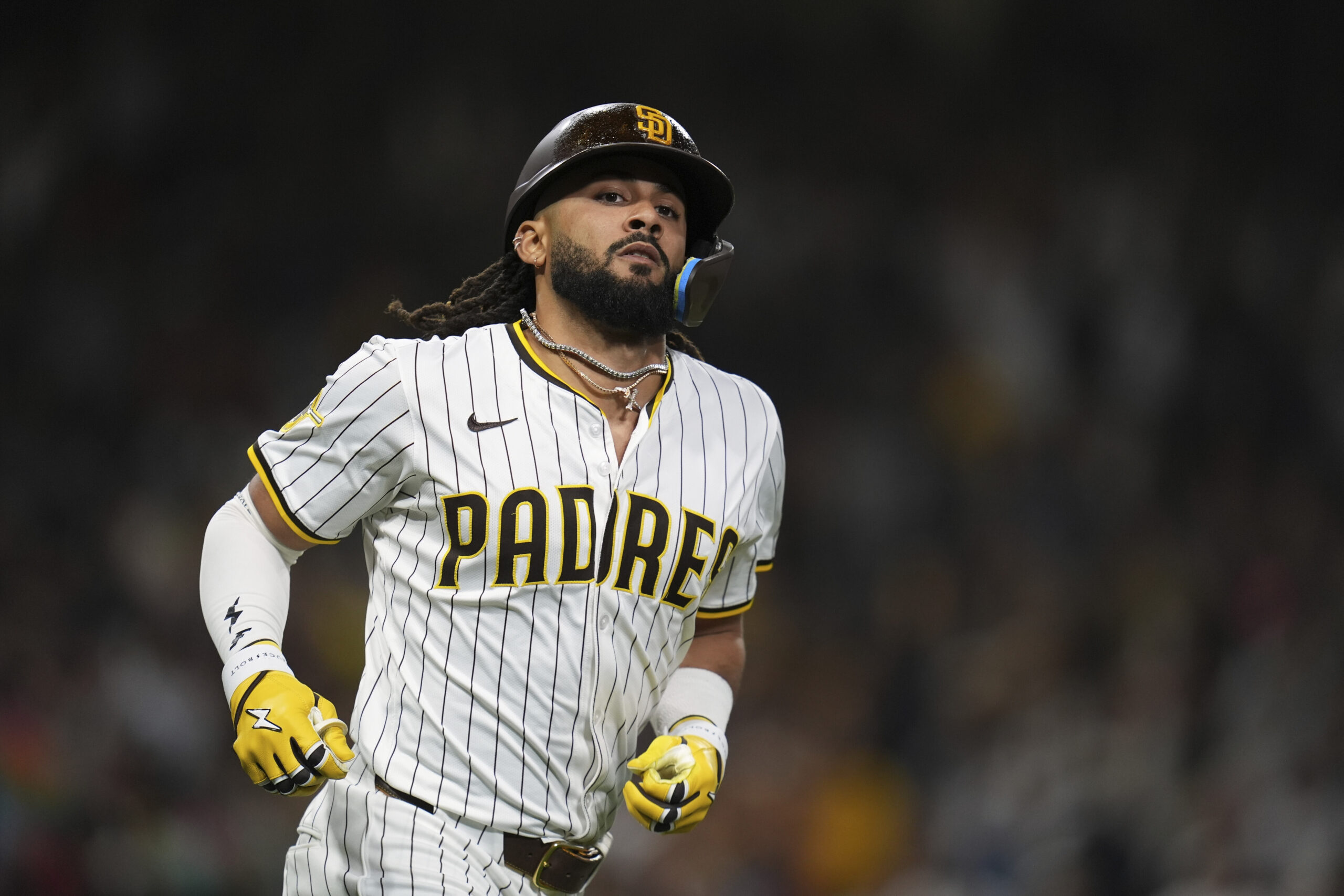 The San Diego Padres’ Fernando Tatis Jr. celebrates after hitting...