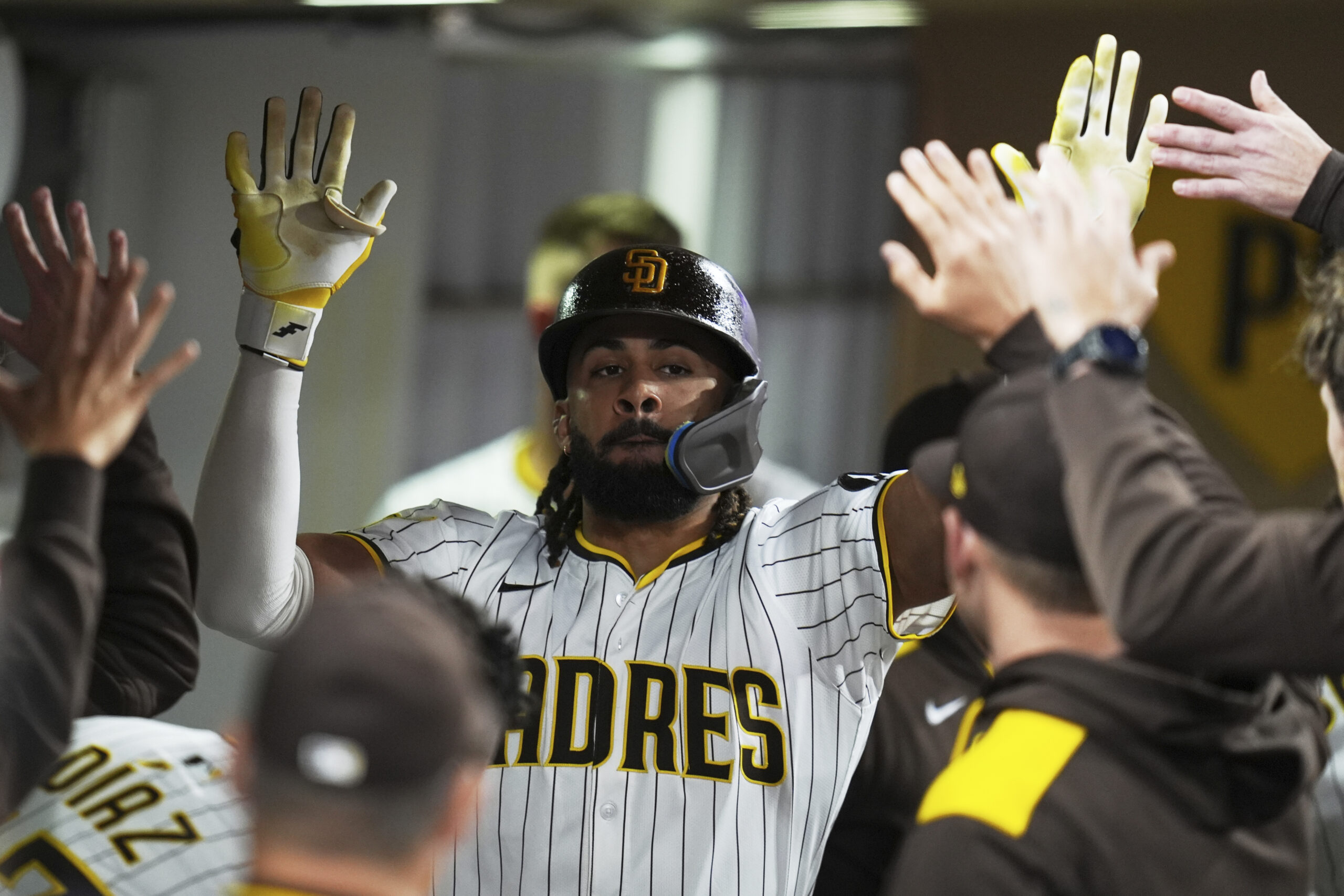 The San Diego Padres’ Fernando Tatis Jr. celebrates after hitting...