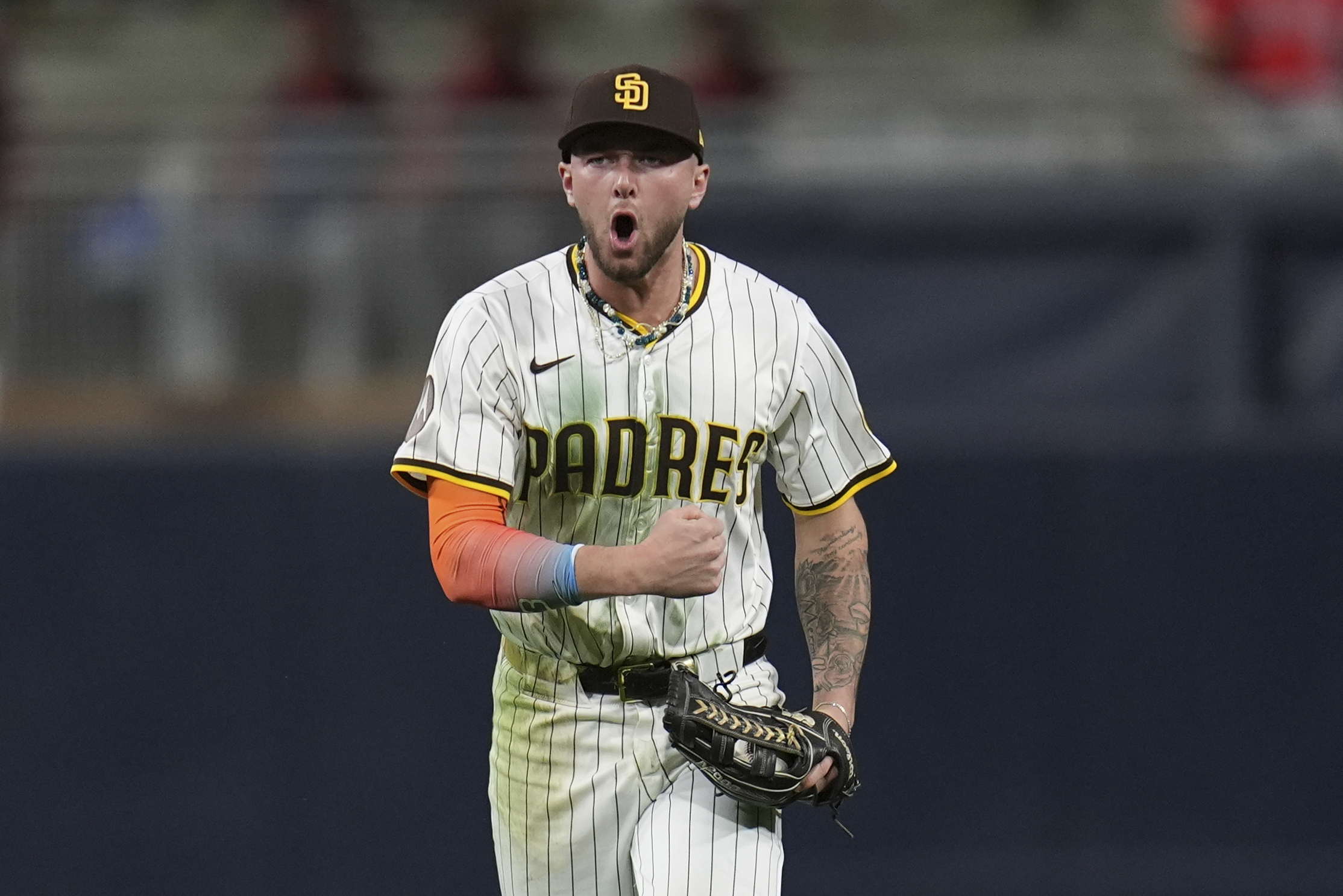 San Diego Padres center fielder Jackson Merrill celebrates after making...