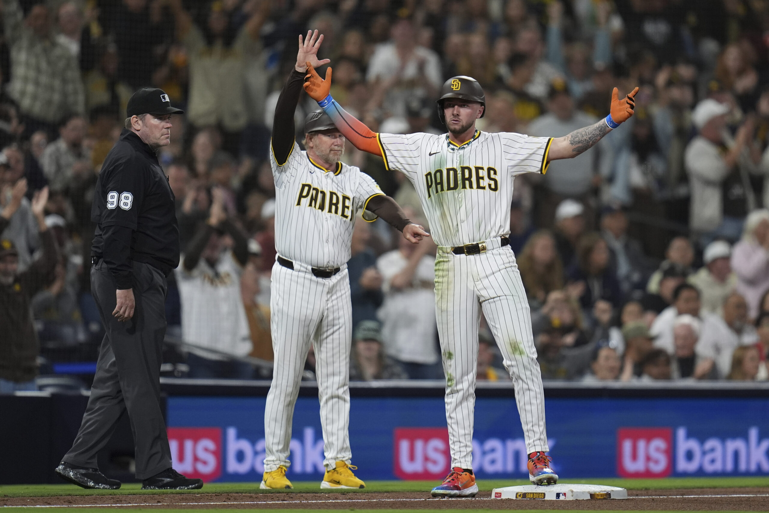 The San Diego Padres’ Jackson Merrill celebrates as he stands...