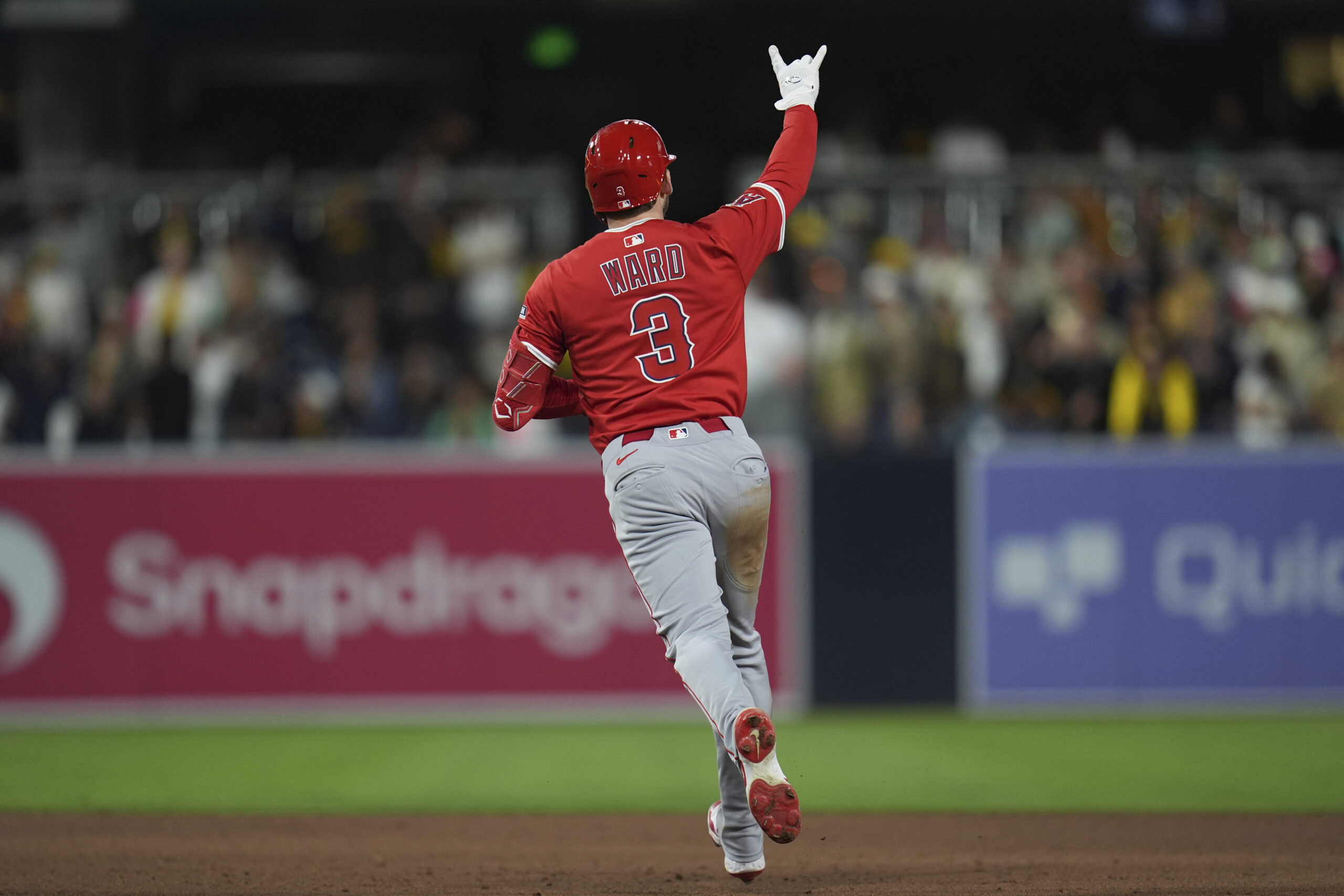 The Angels’ Taylor Ward celebrates as he runs the bases...