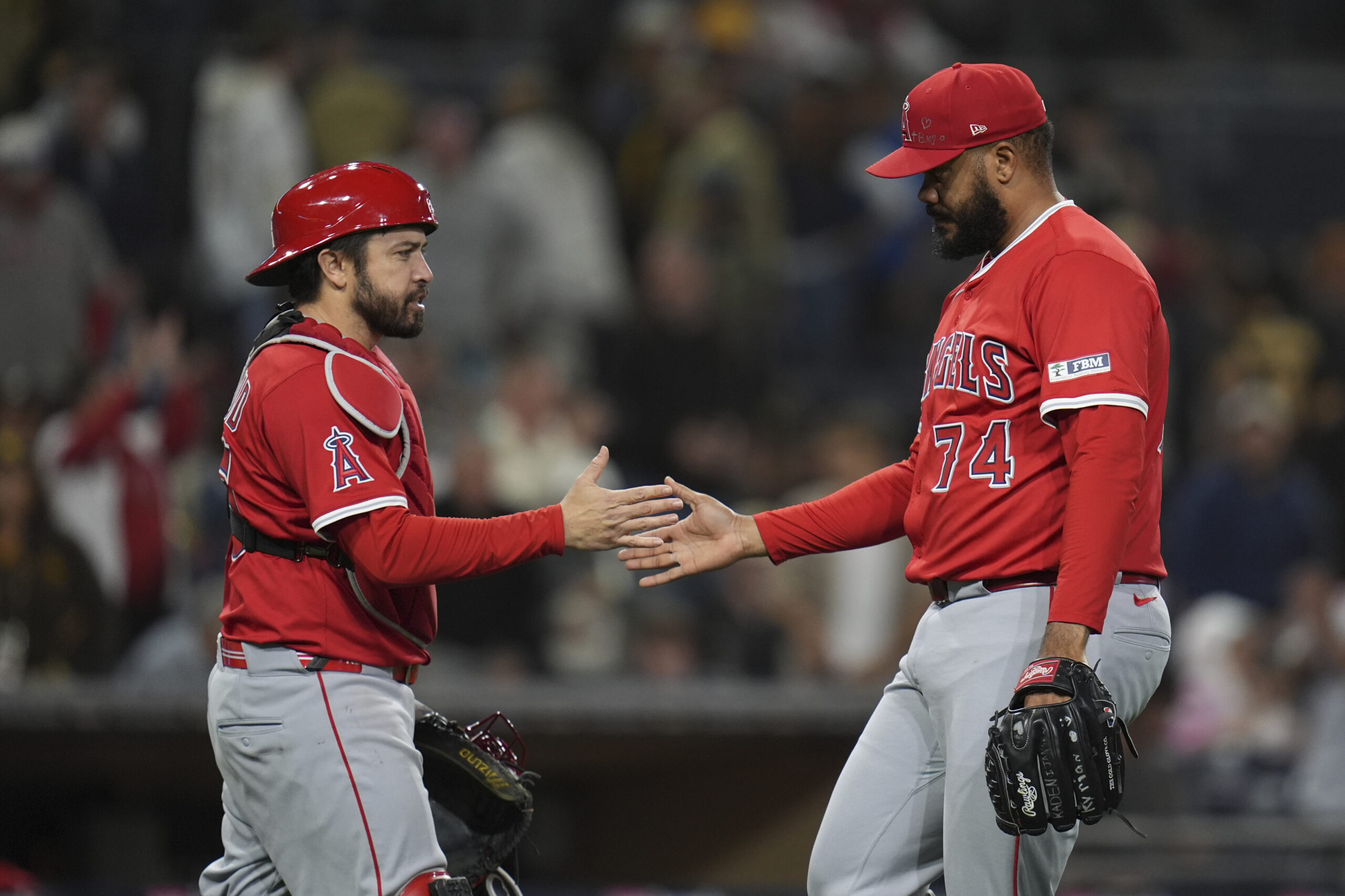 Angels relief pitcher Kenley Jansen, right, celebrates with catcher Travis...