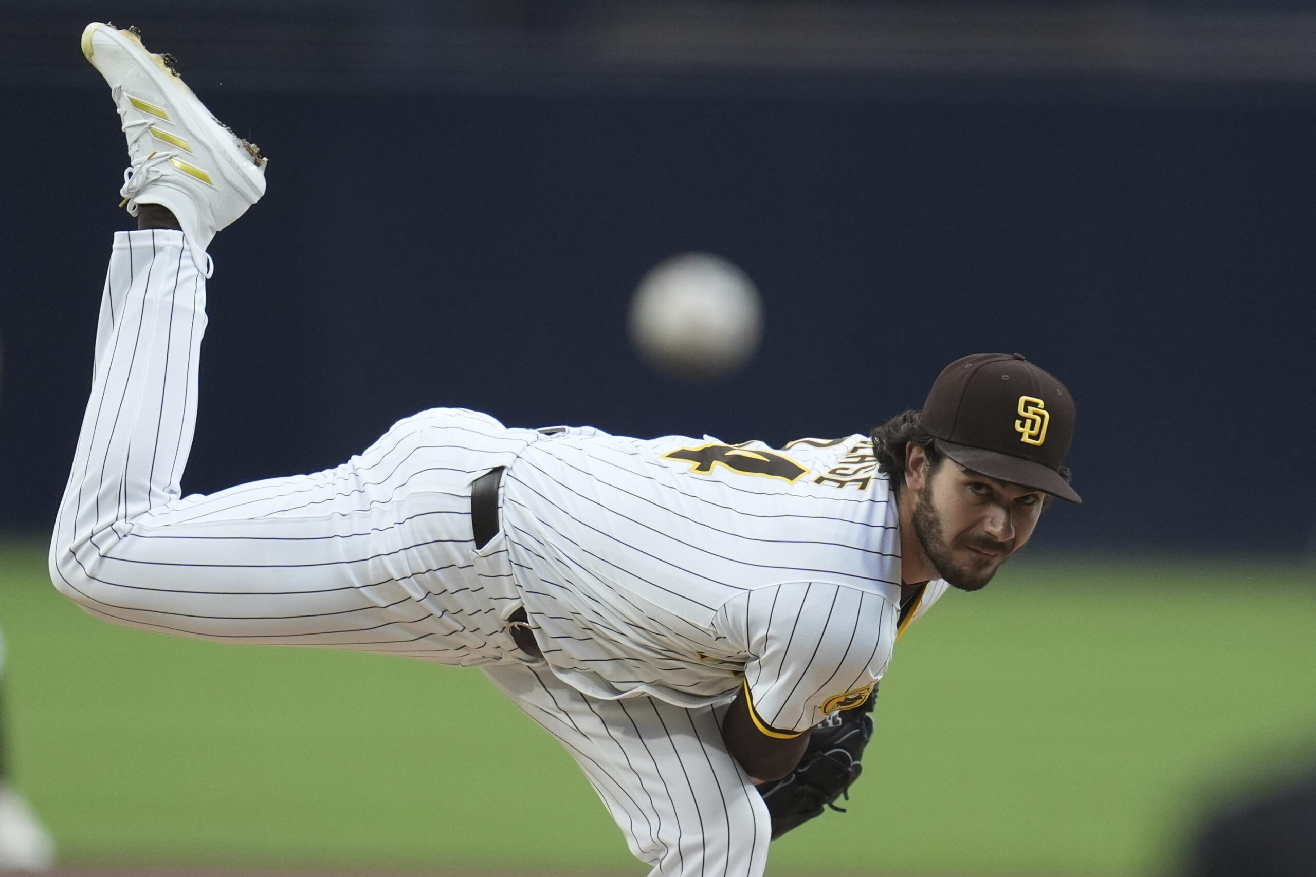 San Diego Padres starting pitcher Dylan Cease throws to the...