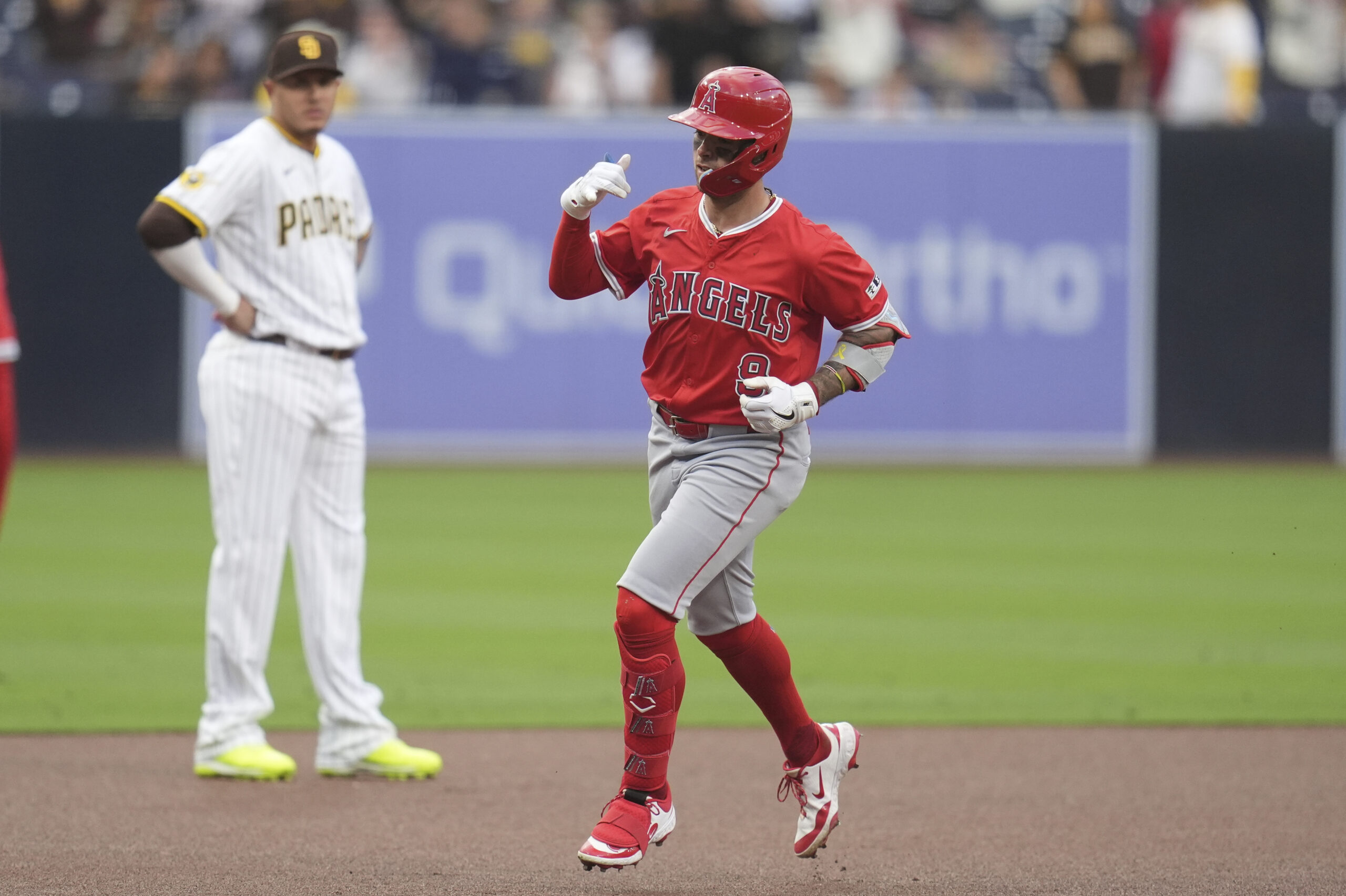 The Angels’ Zach Neto celebrates as he runs the bases...
