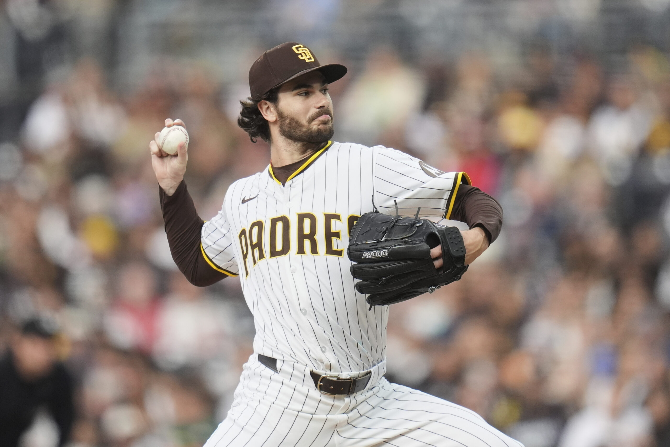 San Diego Padres starting pitcher Dylan Cease throws to the...
