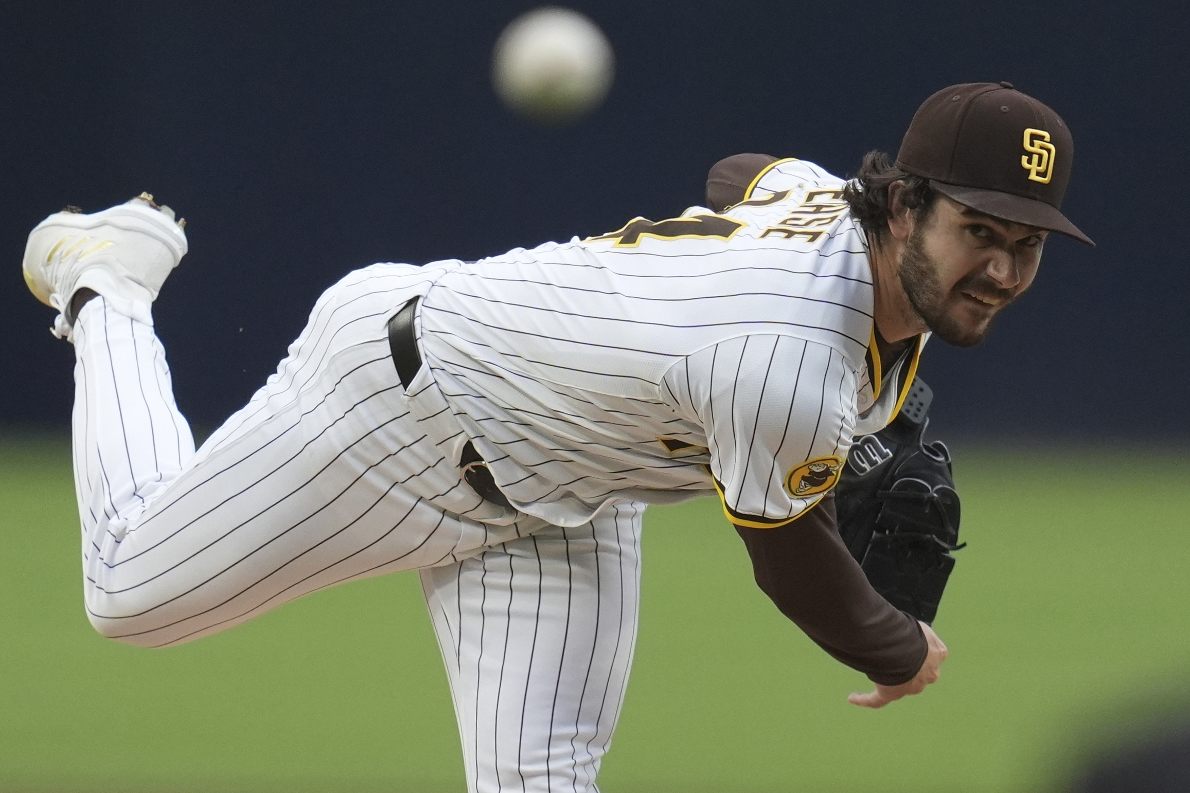 San Diego Padres starting pitcher Dylan Cease throws to the...
