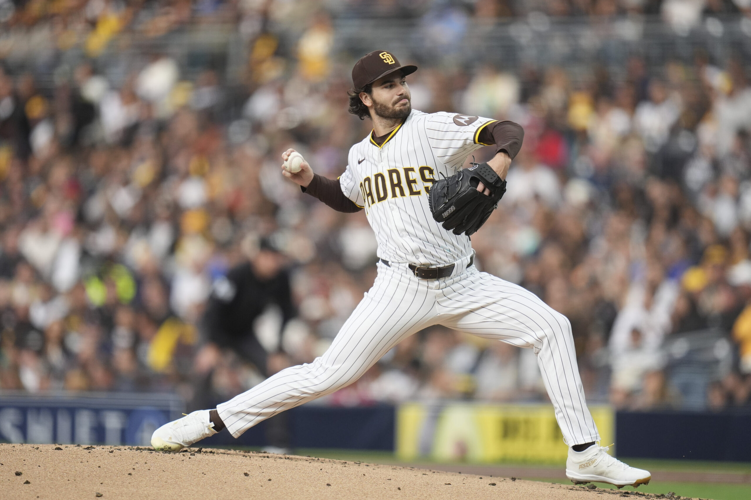 San Diego Padres starting pitcher Dylan Cease throws to the...