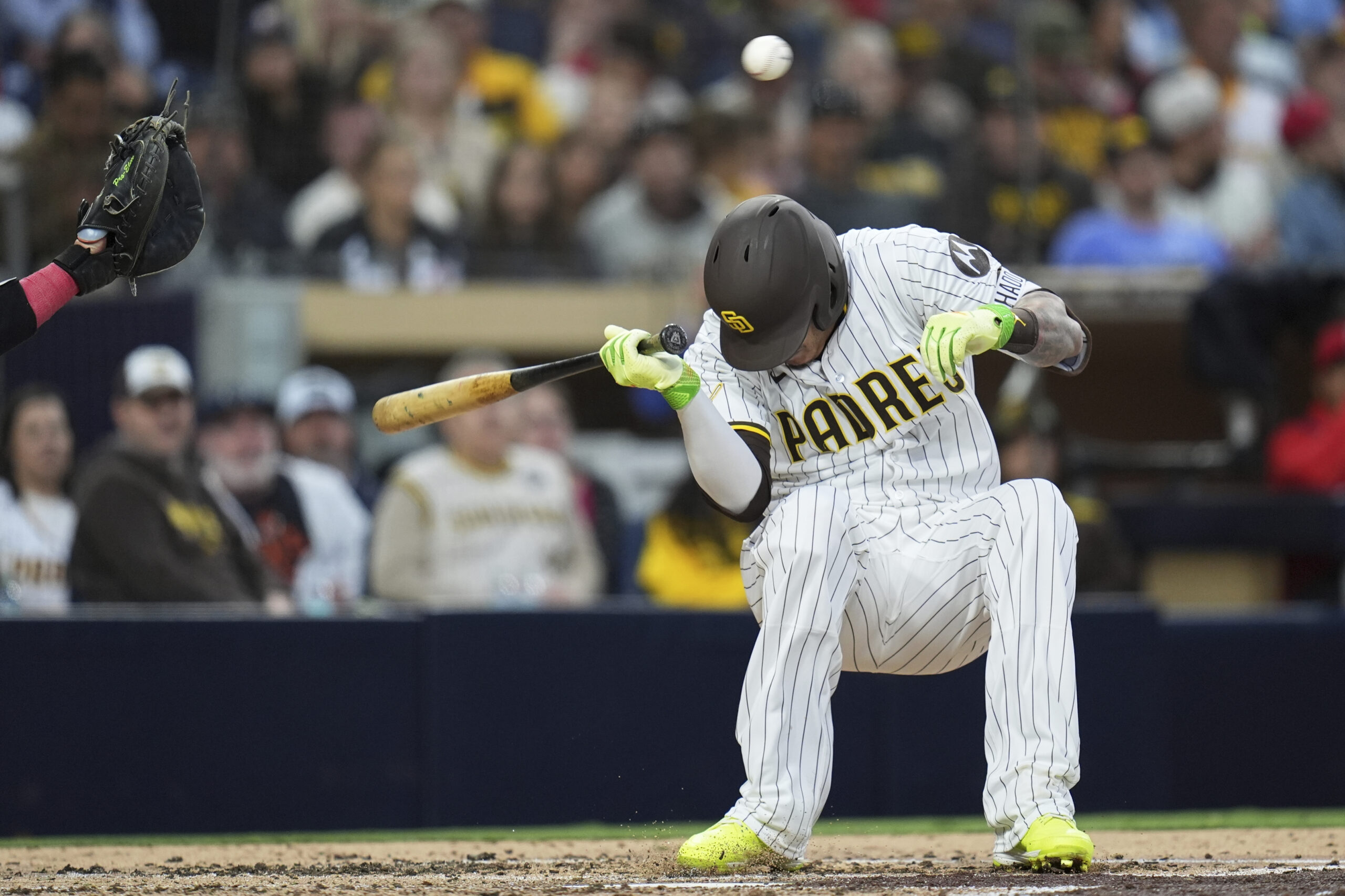 The San Diego Padres’ Manny Machado moves away from a...