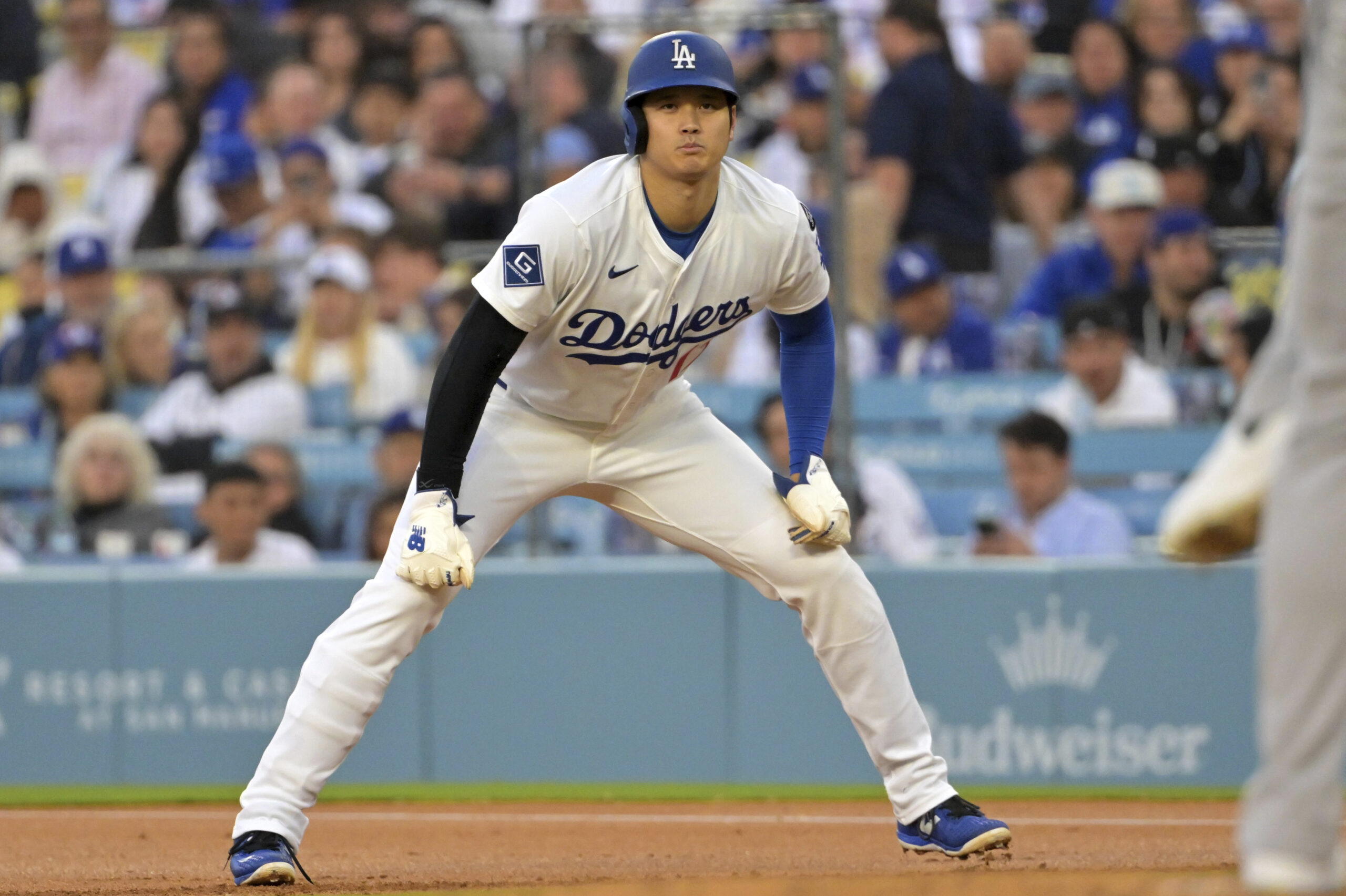 Dodgers star Shohei Ohtani takes a lead off of first...