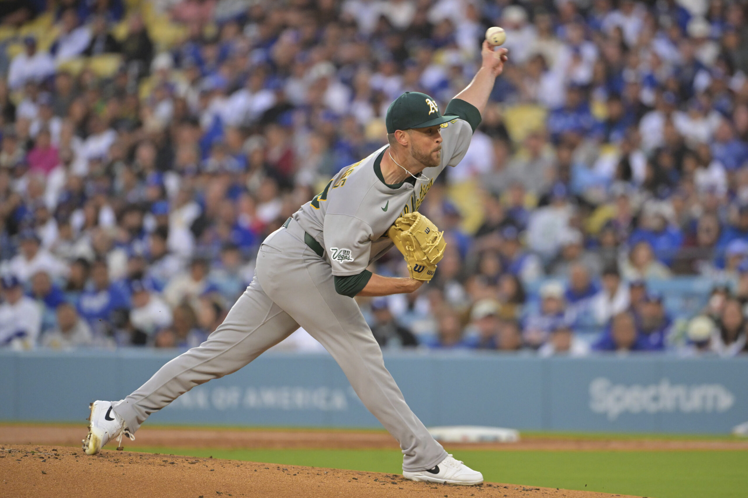 Athletics starting pitcher Jeffrey Springs throws to the plate during...