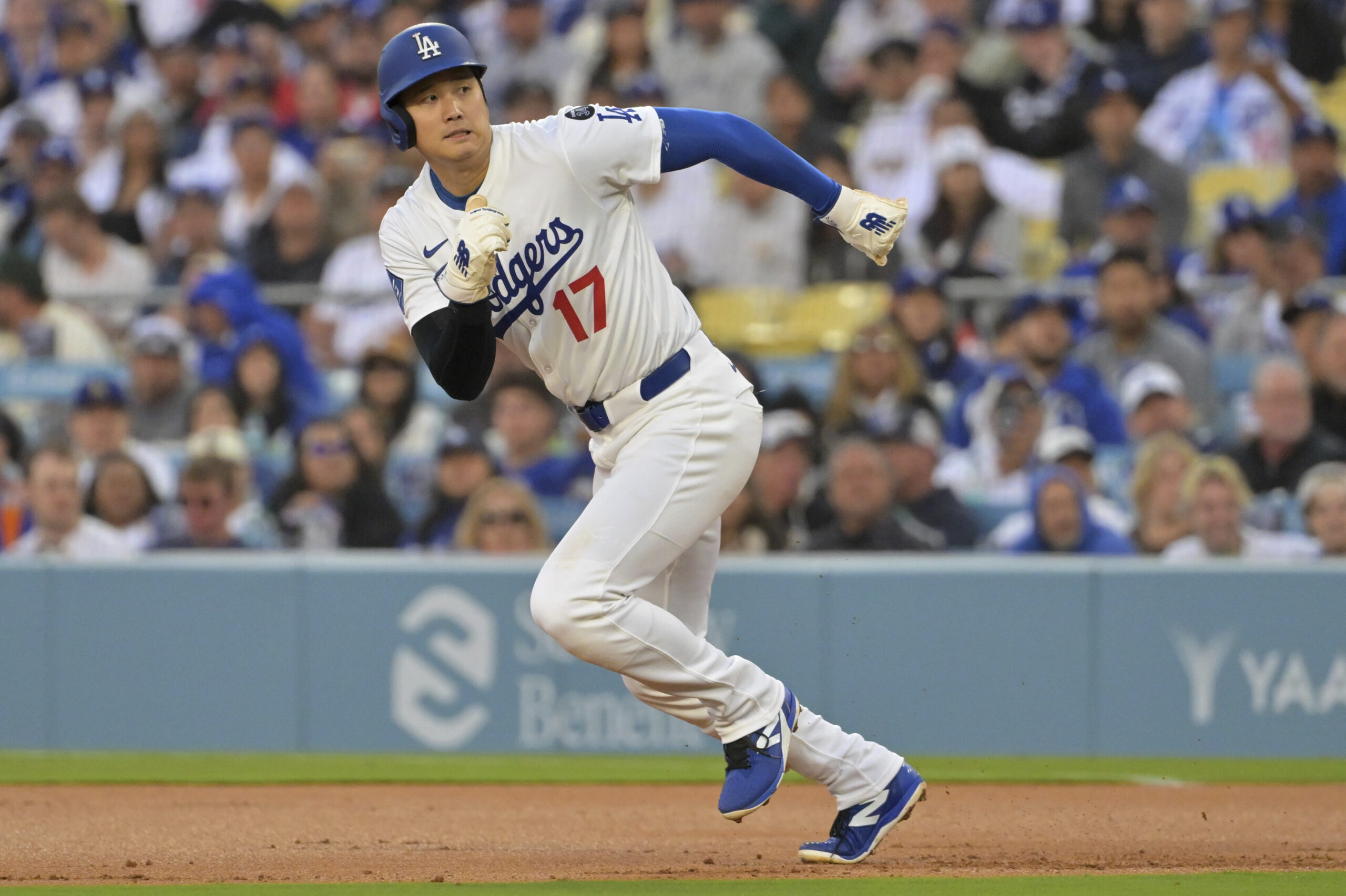 Dodgers star Shohei Ohtani runs to second base on a...