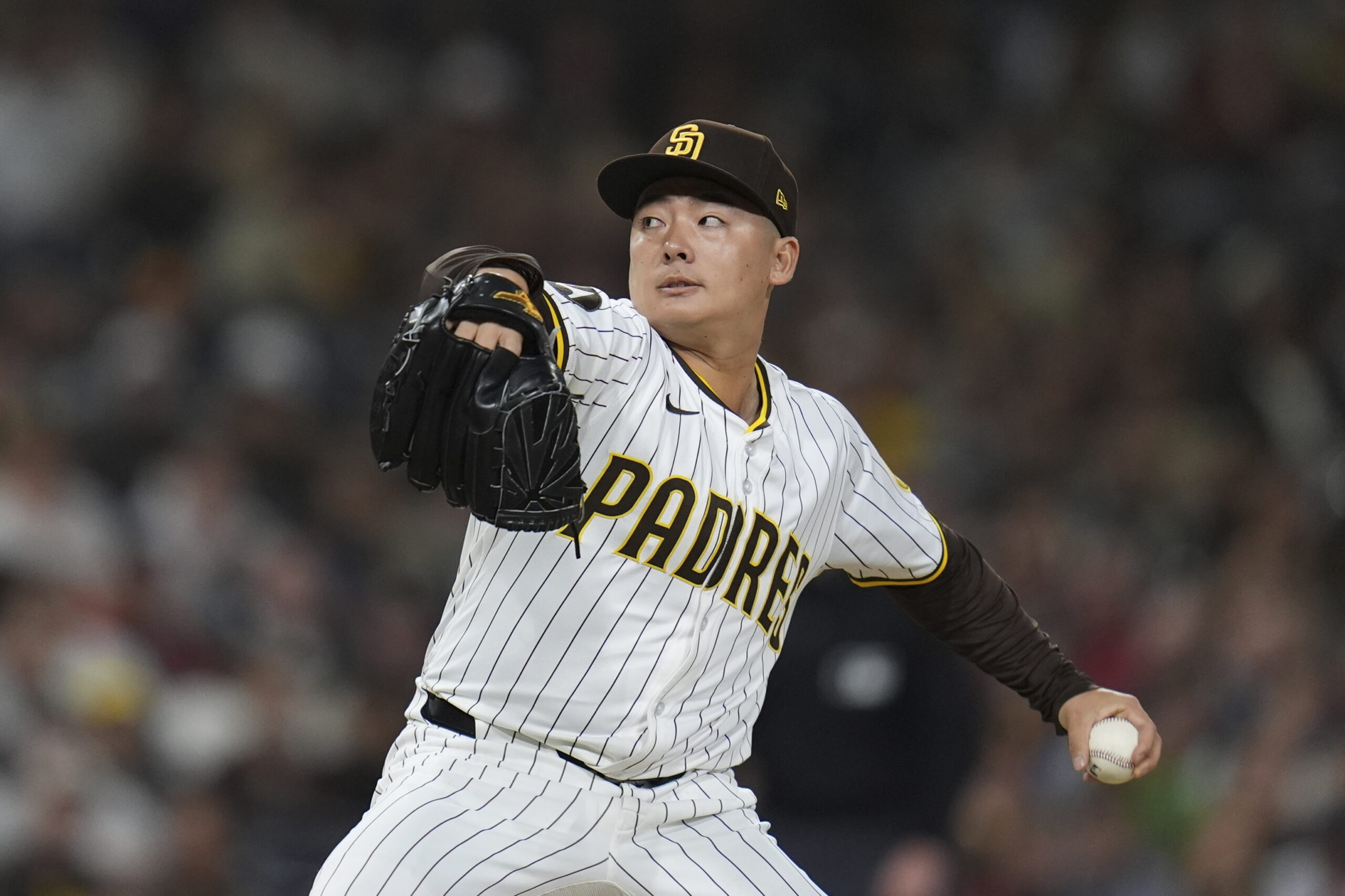 San Diego Padres relief pitcher Yuki Matsui throws to the...