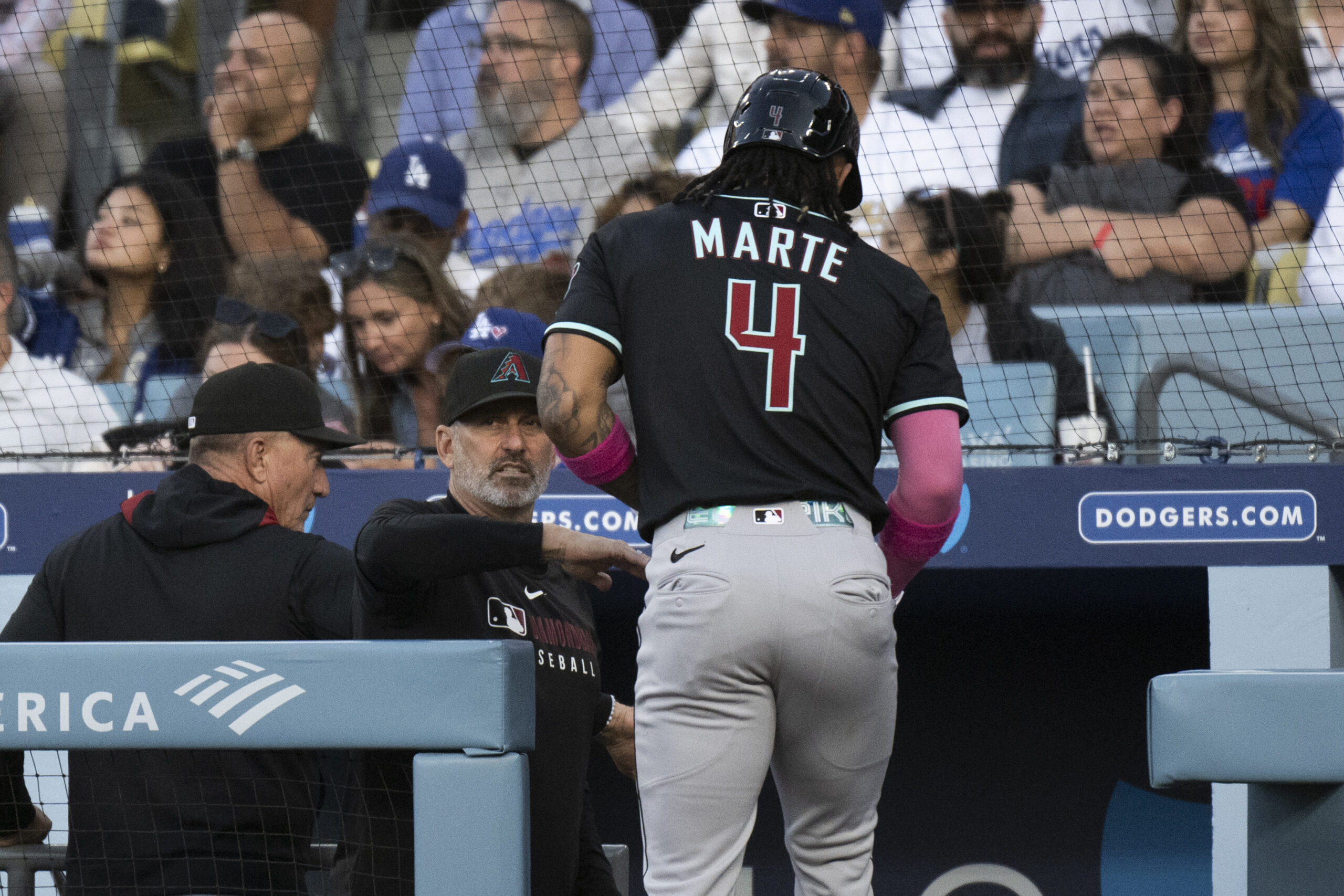 Arizona Diamondbacks manager Torey Lovullo, second from front left, greets...