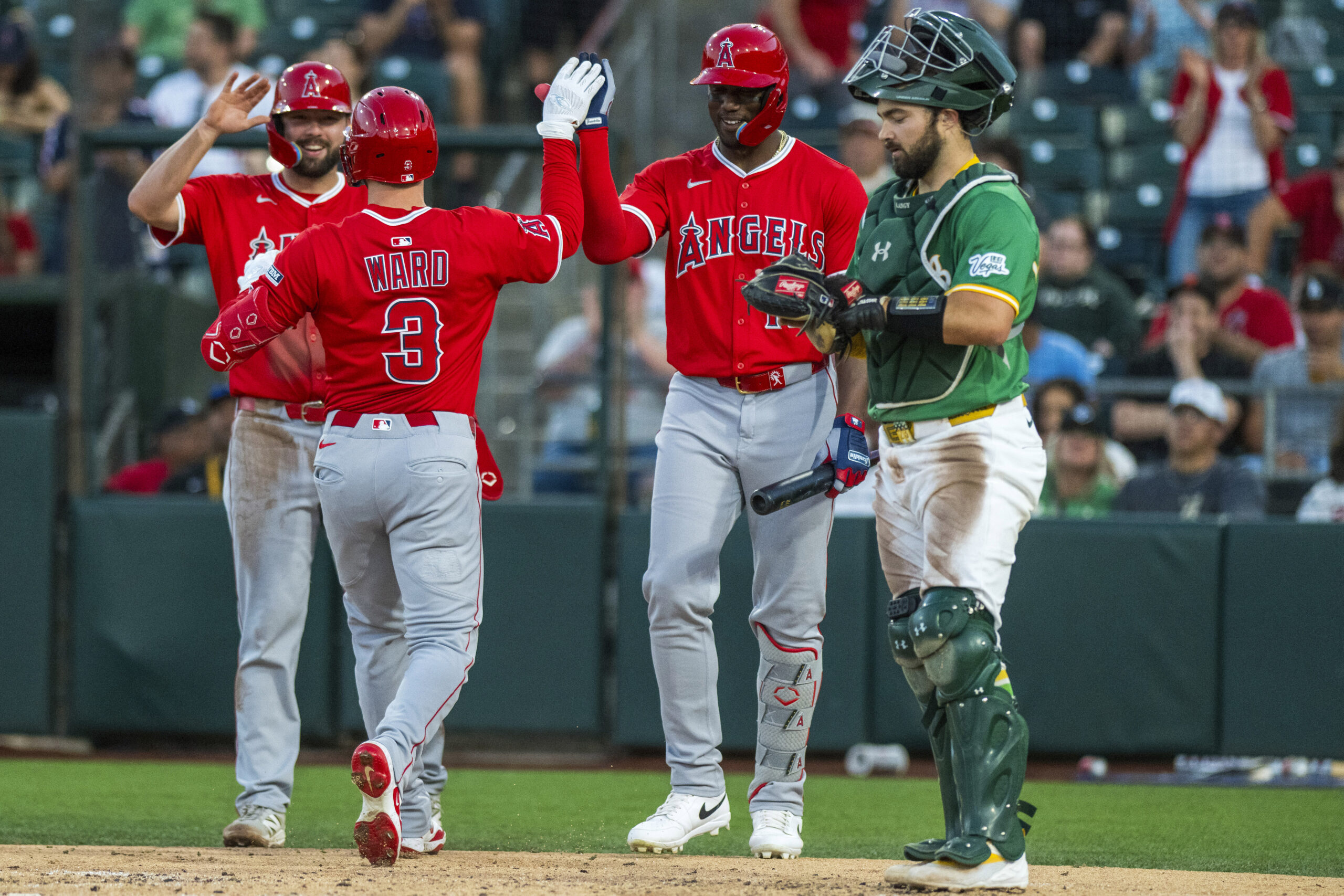 Angels’ Nolan Schanuel, left, and Jorge Soler, second from right,...