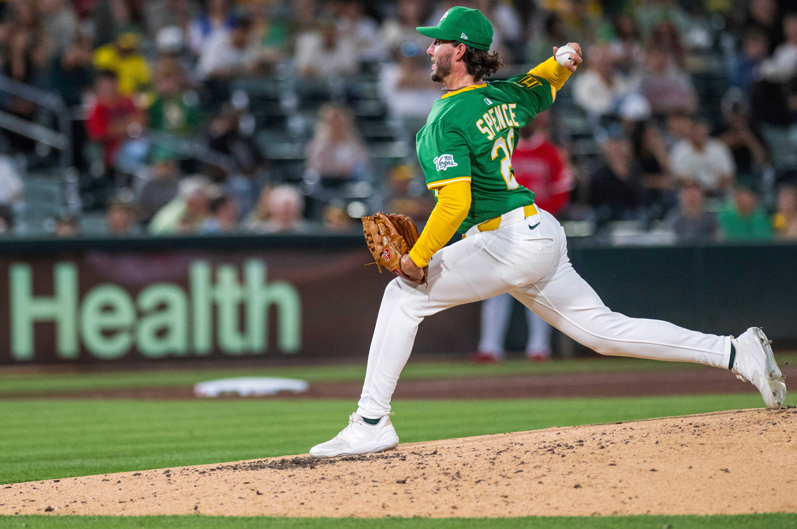 Athletics pitcher Mitch Spence throws during the sixth inning of...