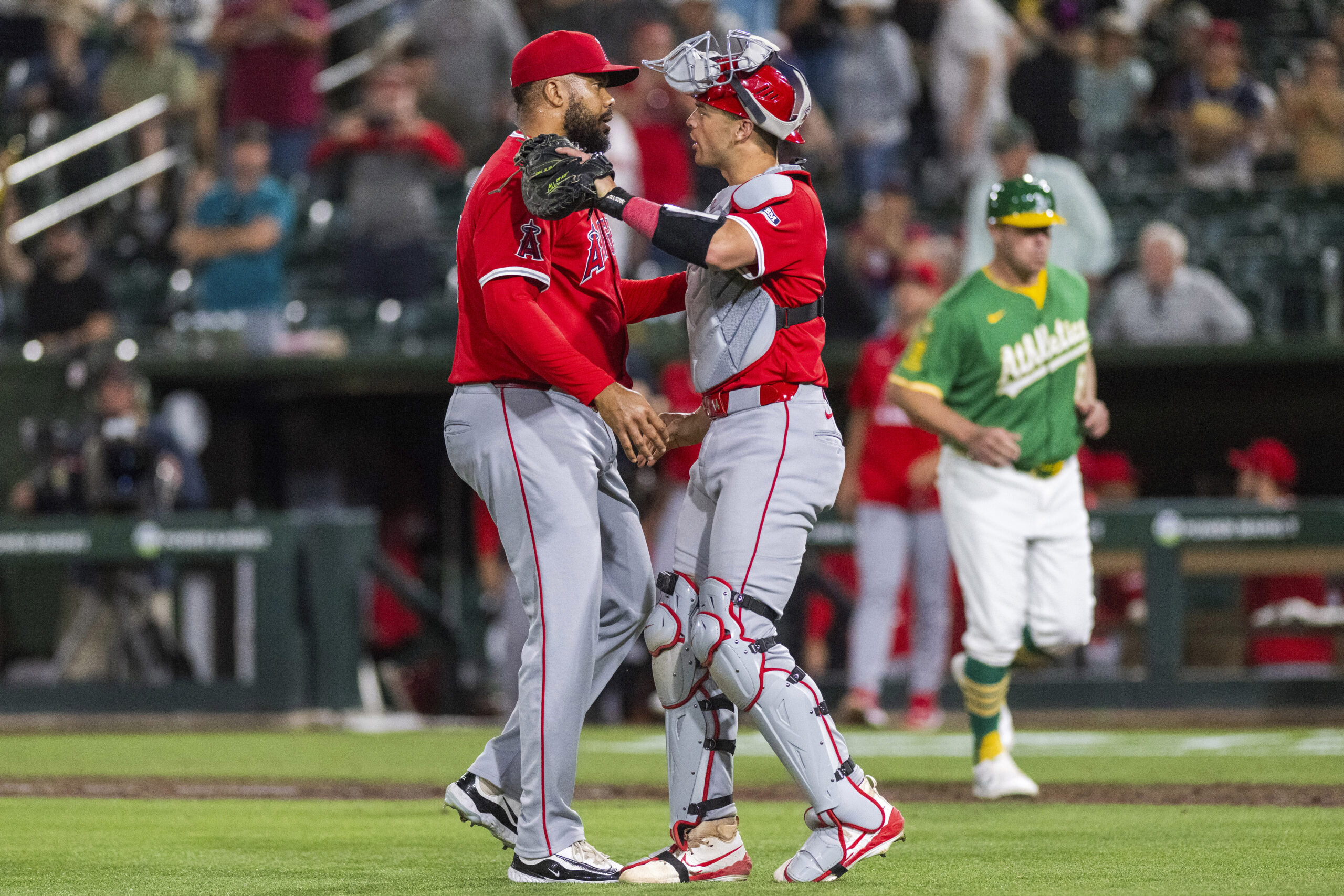 Angels catcher Logan O’Hoppe, right, celebrates with pitcher Kenley Jansen...