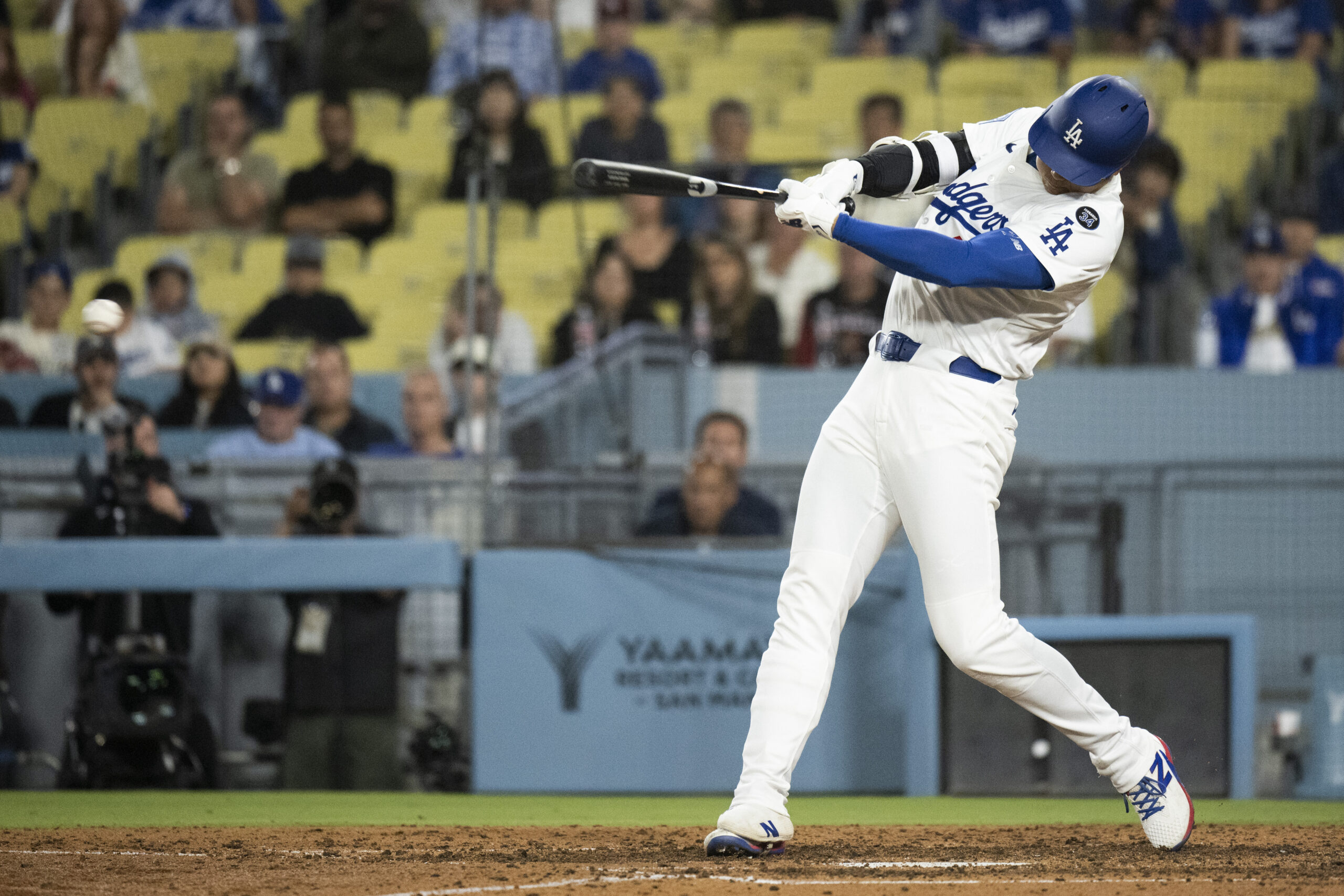 Dodgers’ Shohei Ohtani hits a ground ball during the eighth...