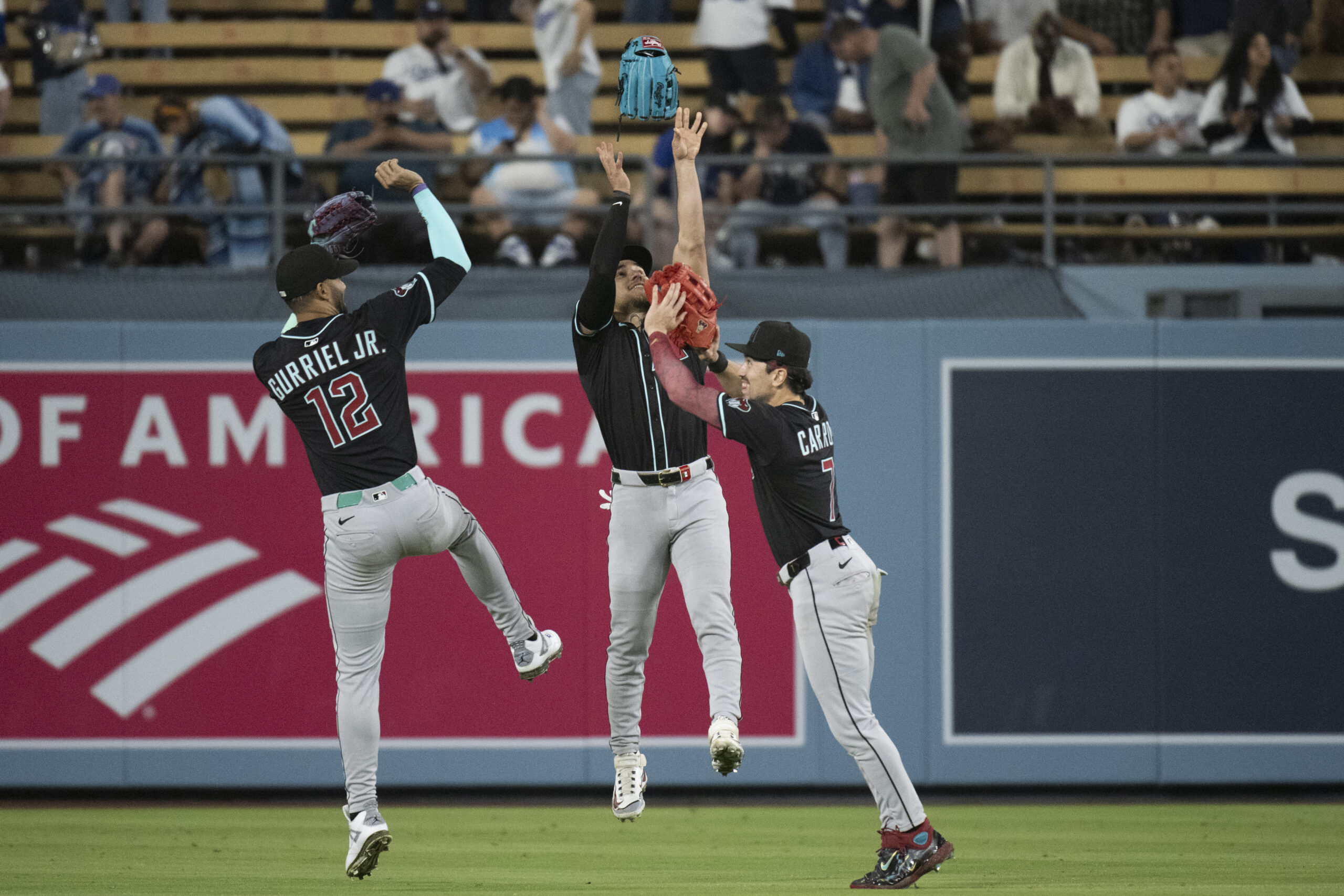 Arizona Diamondbacks left fielder Lourdes Gurriel Jr., left, center fielder...