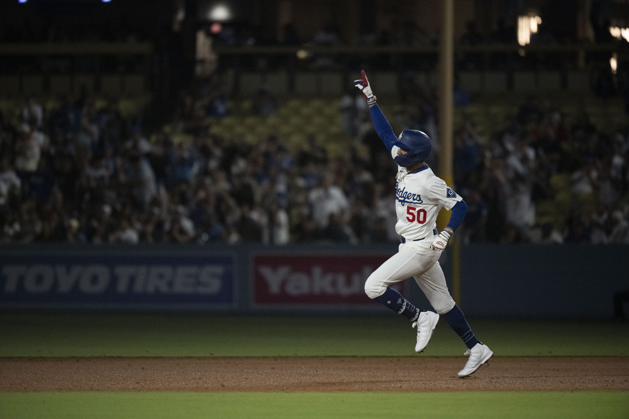 Dodgers’ Mookie Betts celebrates his solo home run during a...