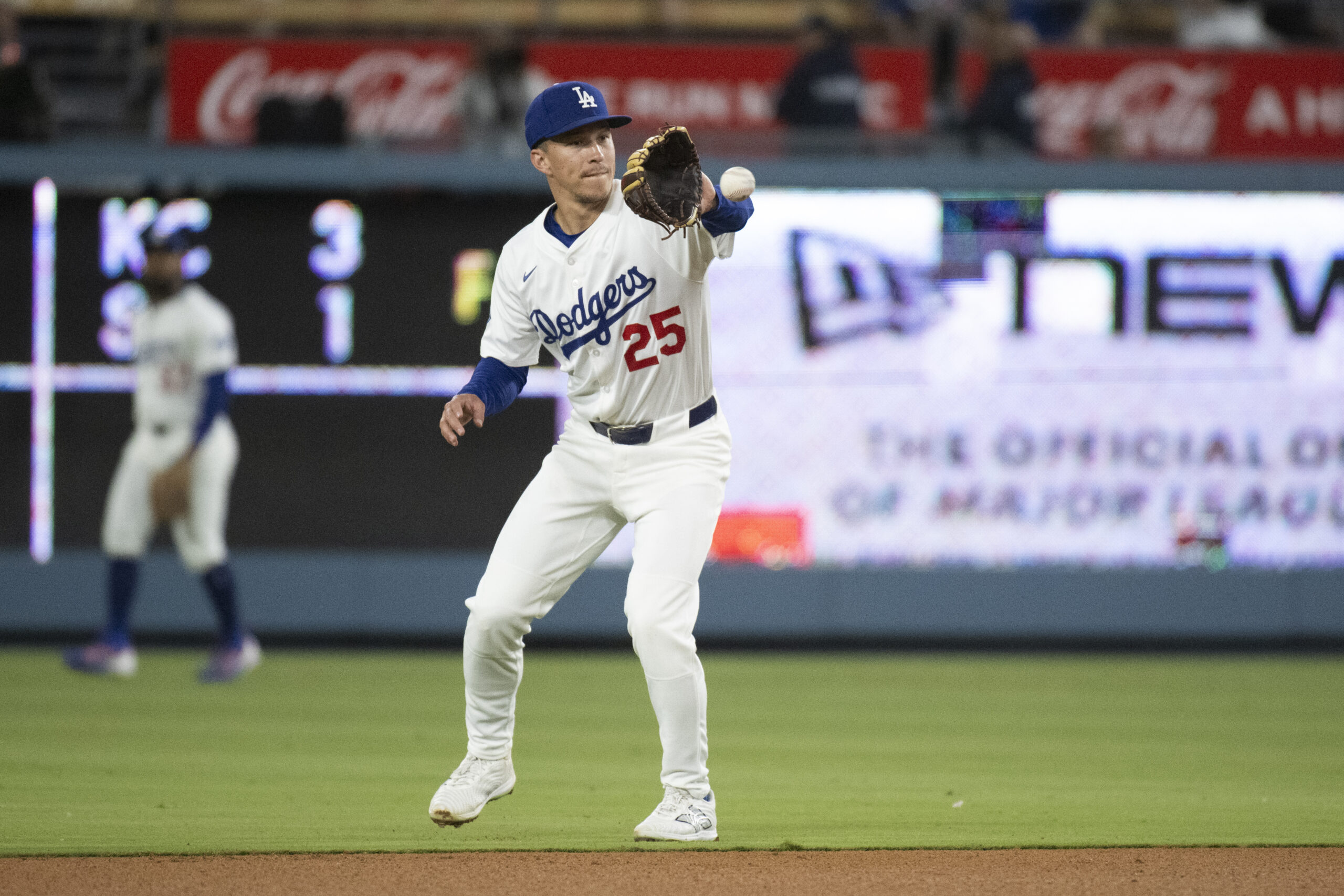 Dodgers second baseman Tommy Edman catches during a baseball game...