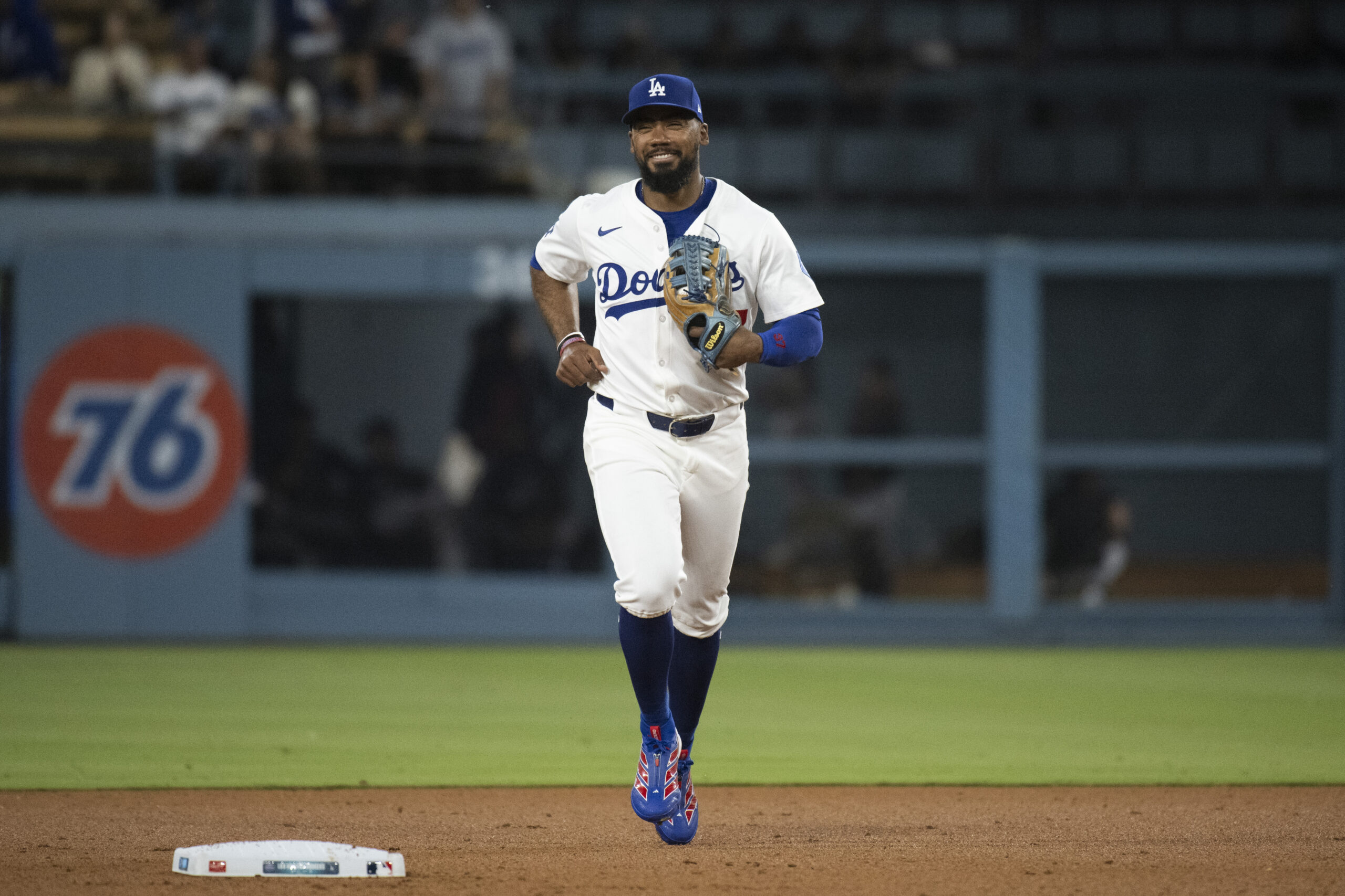 Dodgers right fielder Teoscar Hernández jogs back to the dugout...
