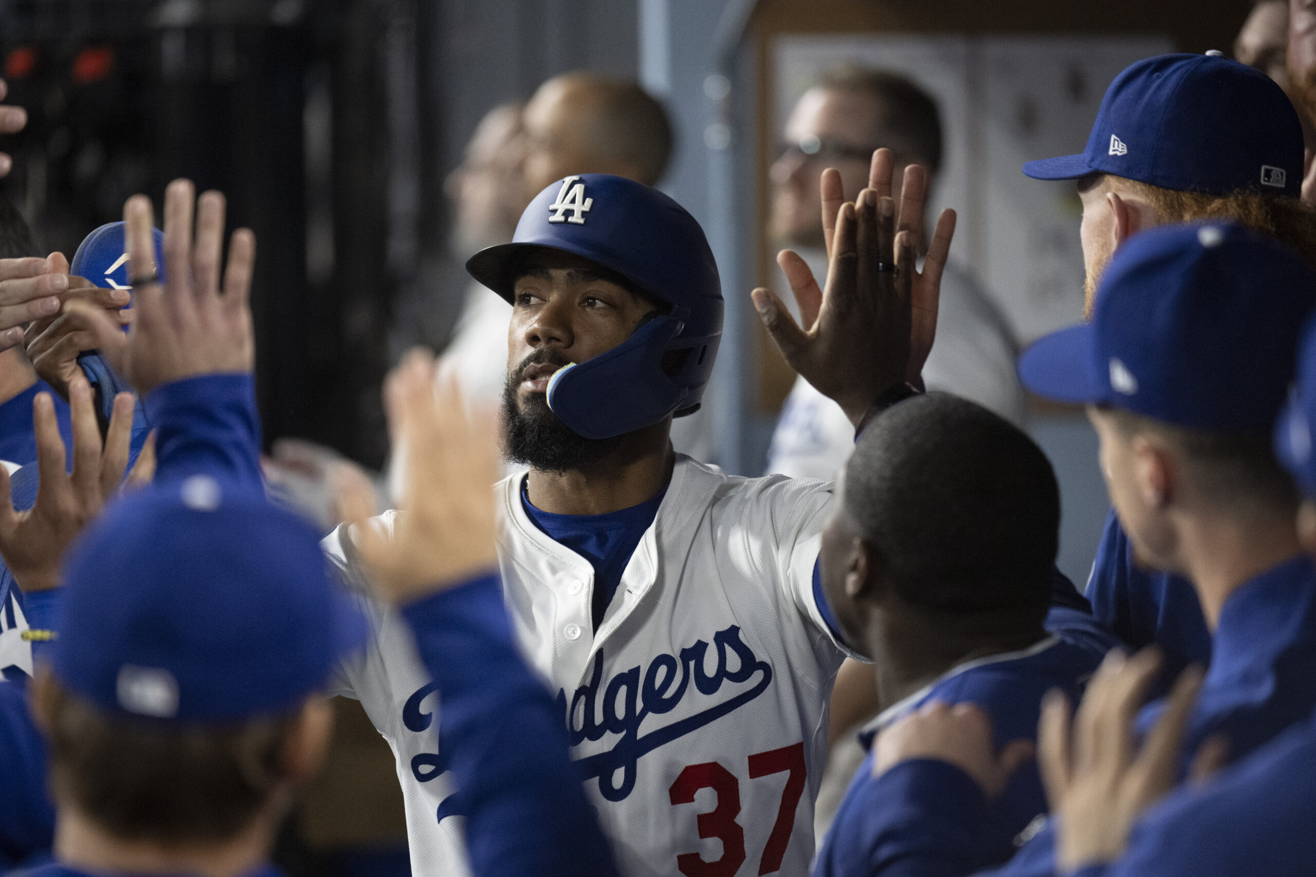 Dodgers’ Teoscar Hernández celebrates after scoring on an RBI single...