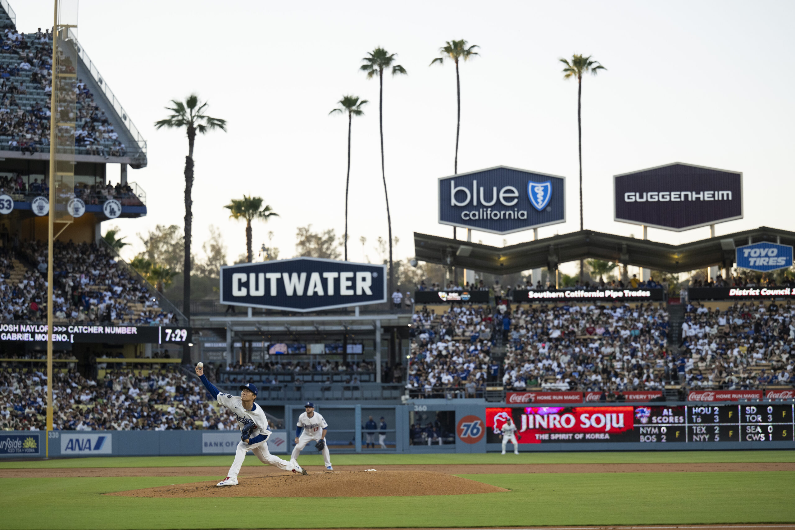 Dodgers starting pitcher Yoshinobu Yamamoto delivers a pitch during the...