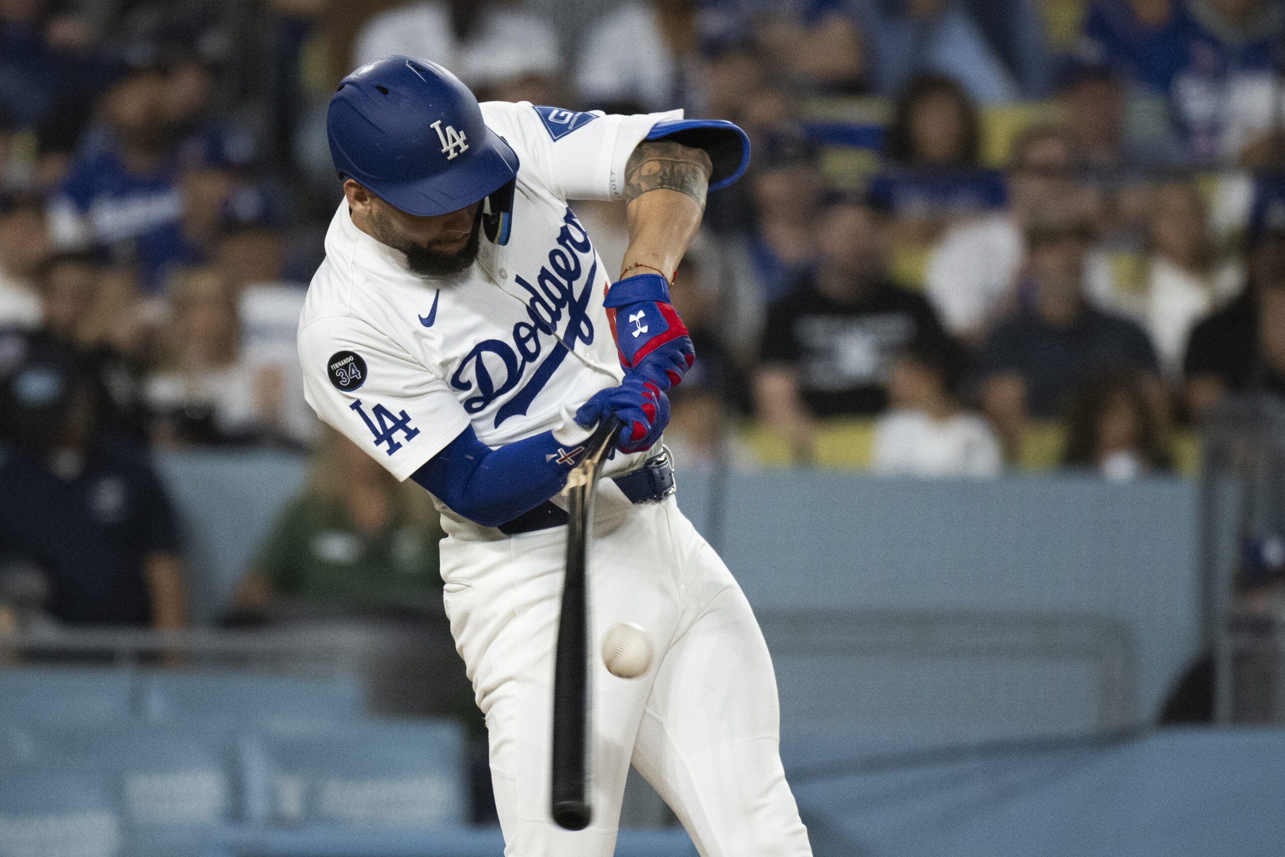 Dodgers’ Andy Pages breaks his bat during the fourth inning...