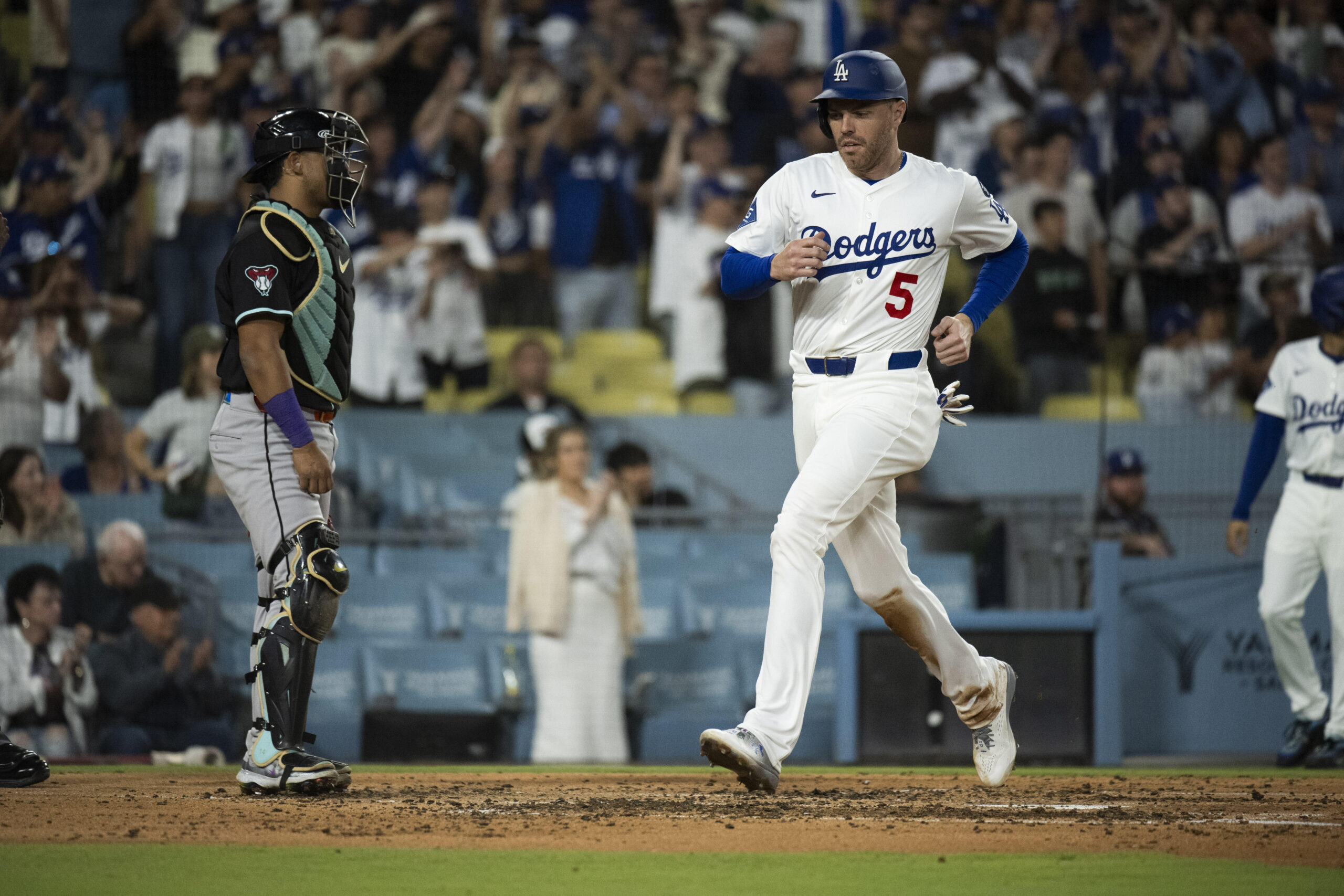 Dodgers’ Freddie Freeman scores on an RBI double by Will...