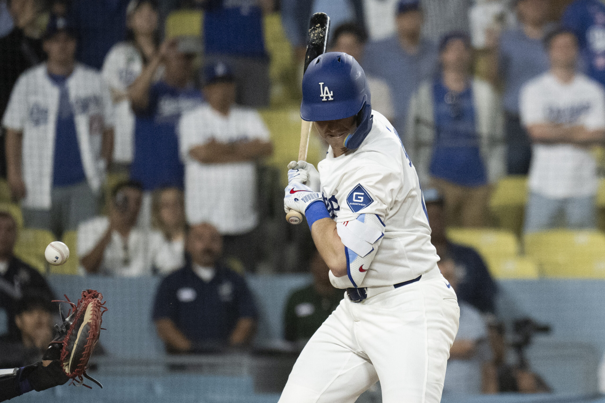 Dodgers’ Will Smith takes a hit by pitch during the...