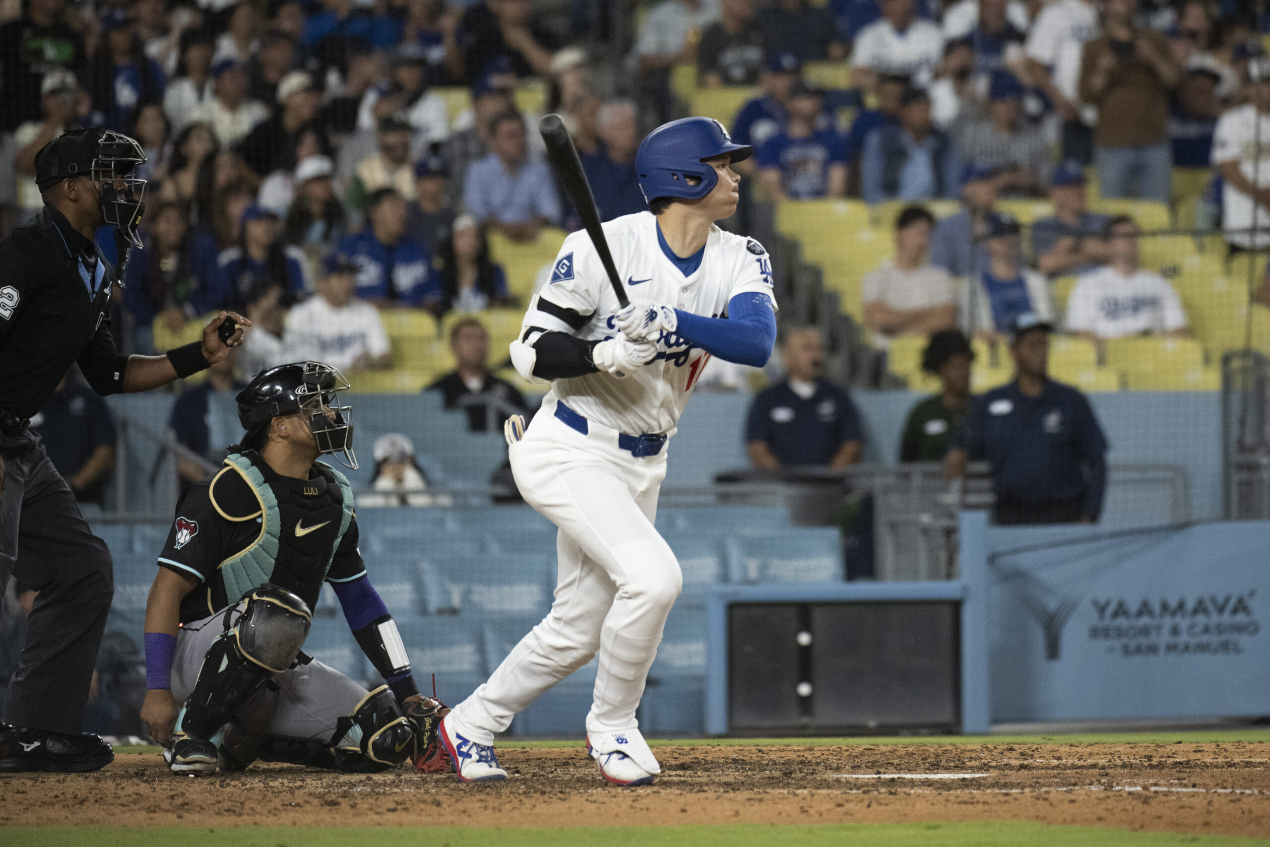 Dodgers’ Shohei Ohtani hits a double during the eighth inning...