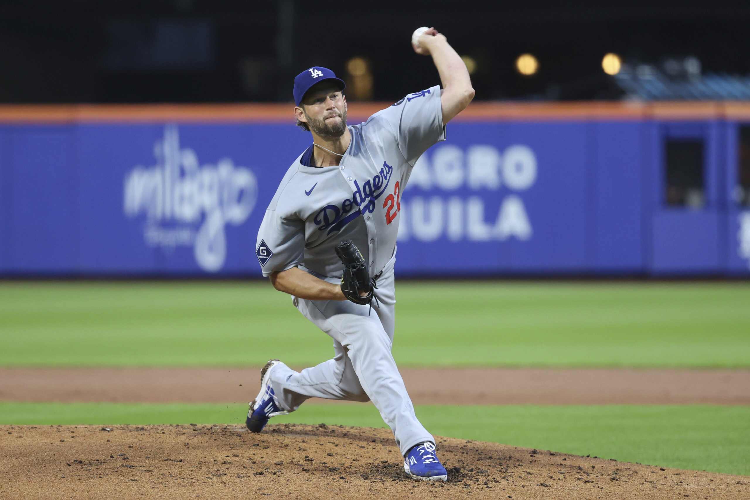 Dodgers starting pitcher Clayton Kershaw throws to the plate during...